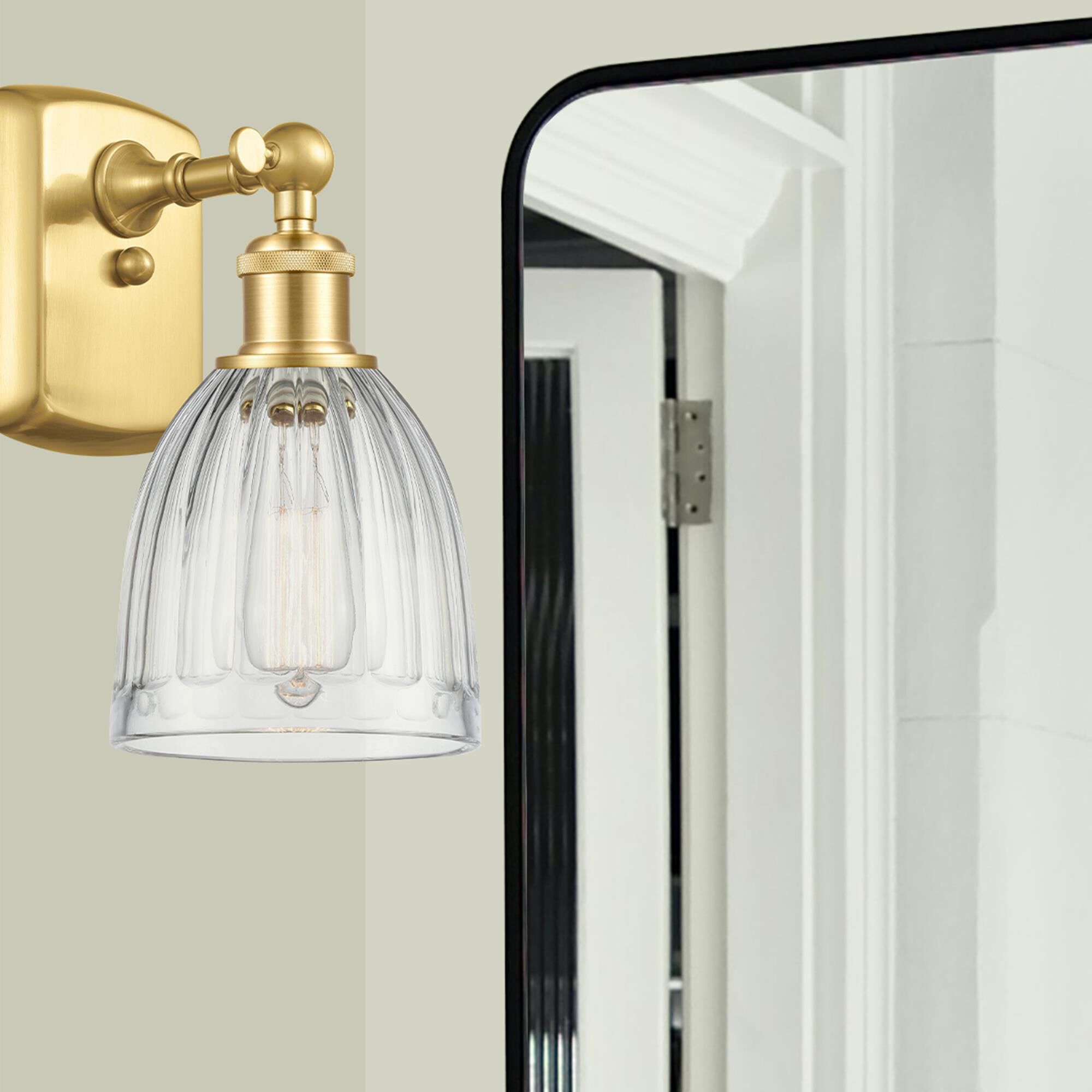 Shown in Satin Gold finish and Clear Brookfield glass