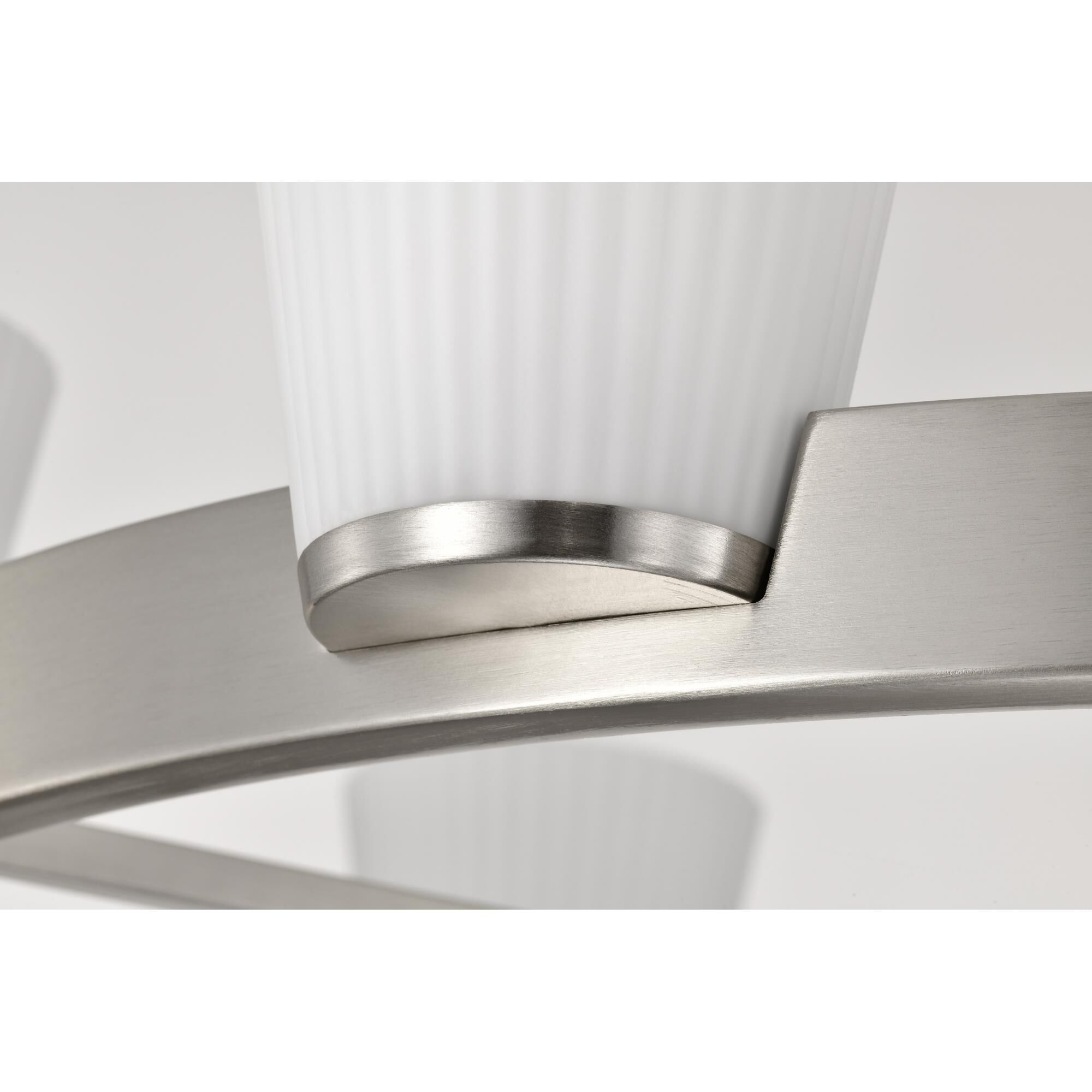 Shown in Brushed Nickel finish and Ribbed White glass