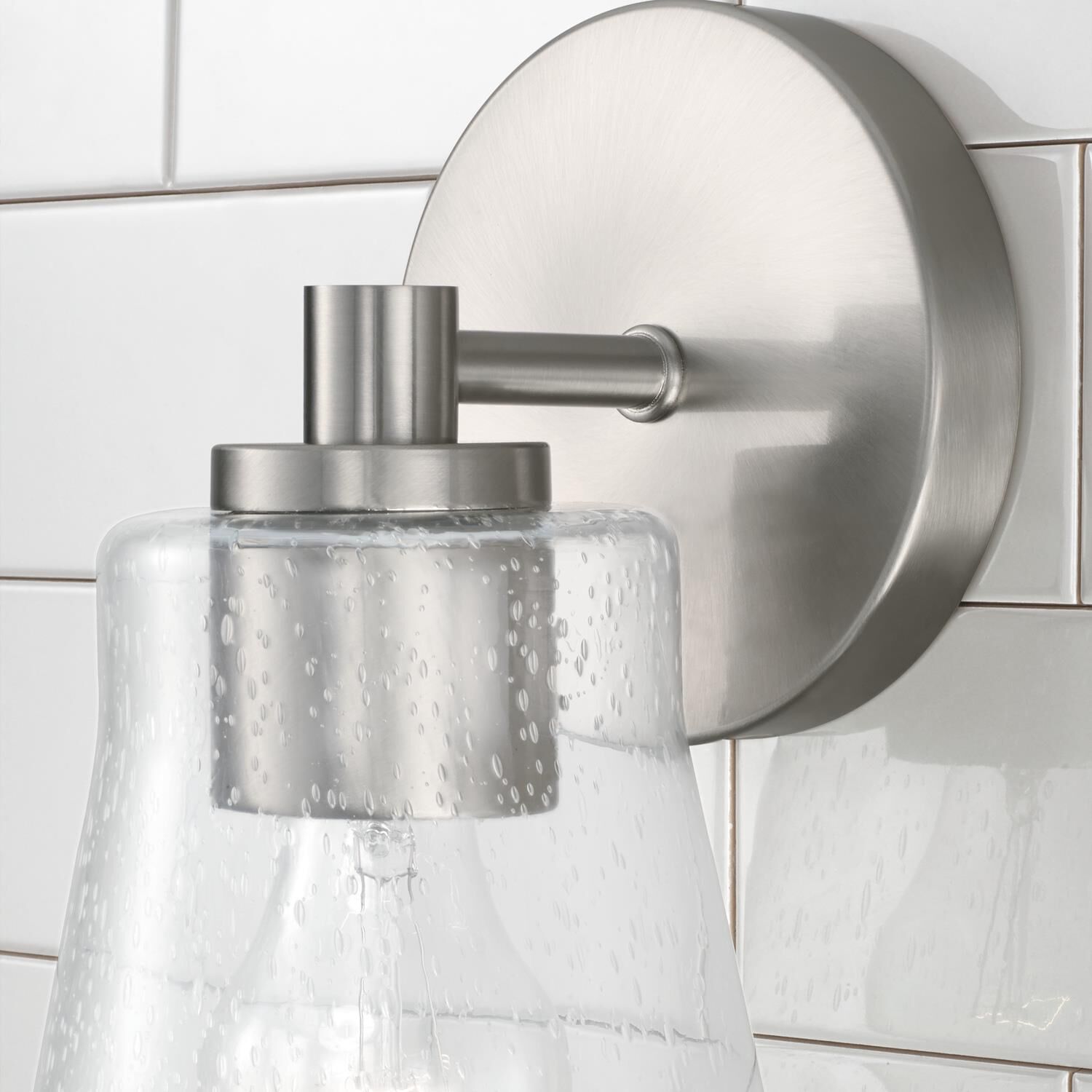 Shown in Brushed Nickel finish and Clear Seeded glass