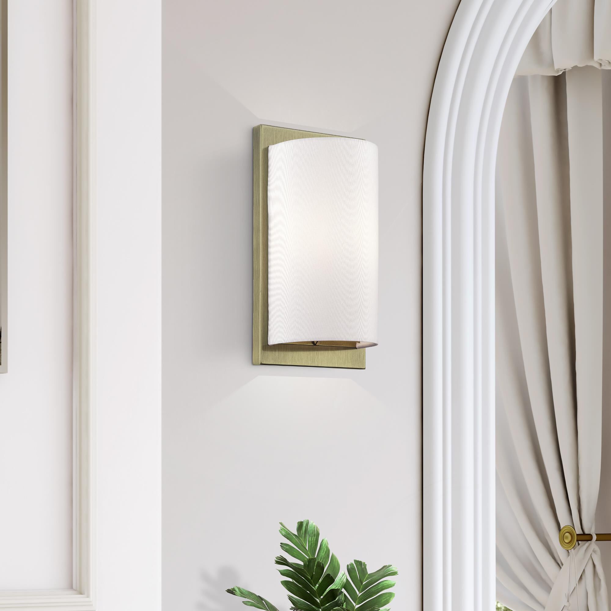 Shown in Antique Brass finish and Hand Crafted Off-White Fabric Hardback shade