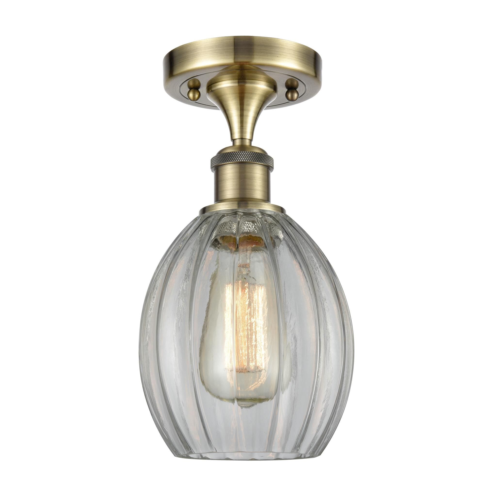 Shown in Antique Brass finish and Sphere glass and Glass shade