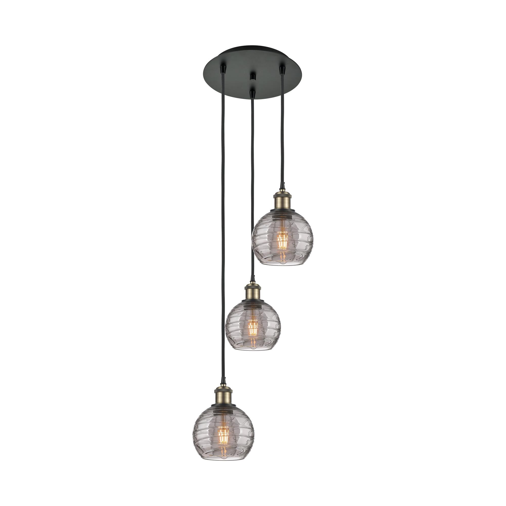 Shown in Black Antique Brass finish and Light Smoke Deco Swirl glass