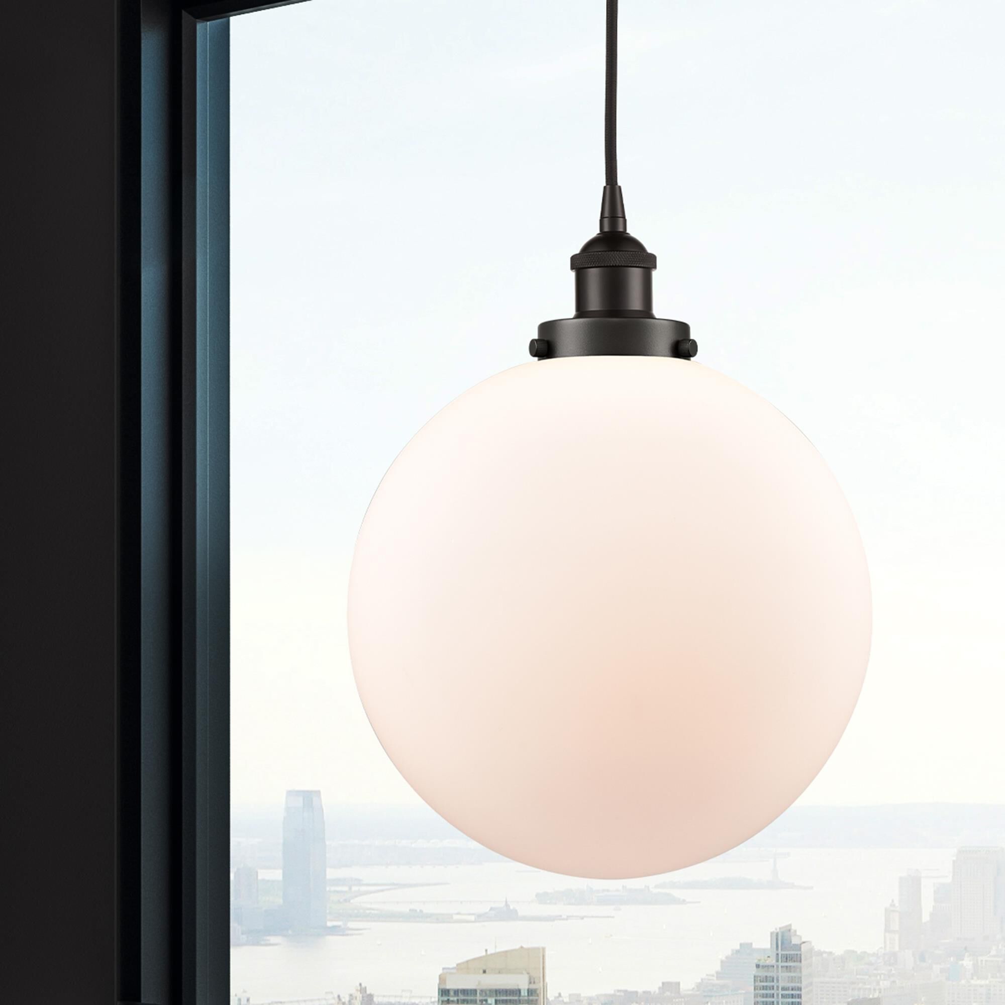 Shown in Oil Rubbed Bronze finish and Matte White Cased Beacon glass