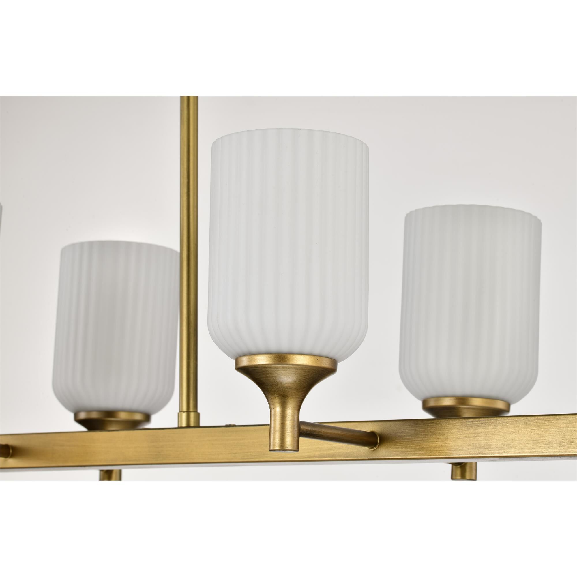 Shown in Natural Brass finish and Frosted Ribbed glass
