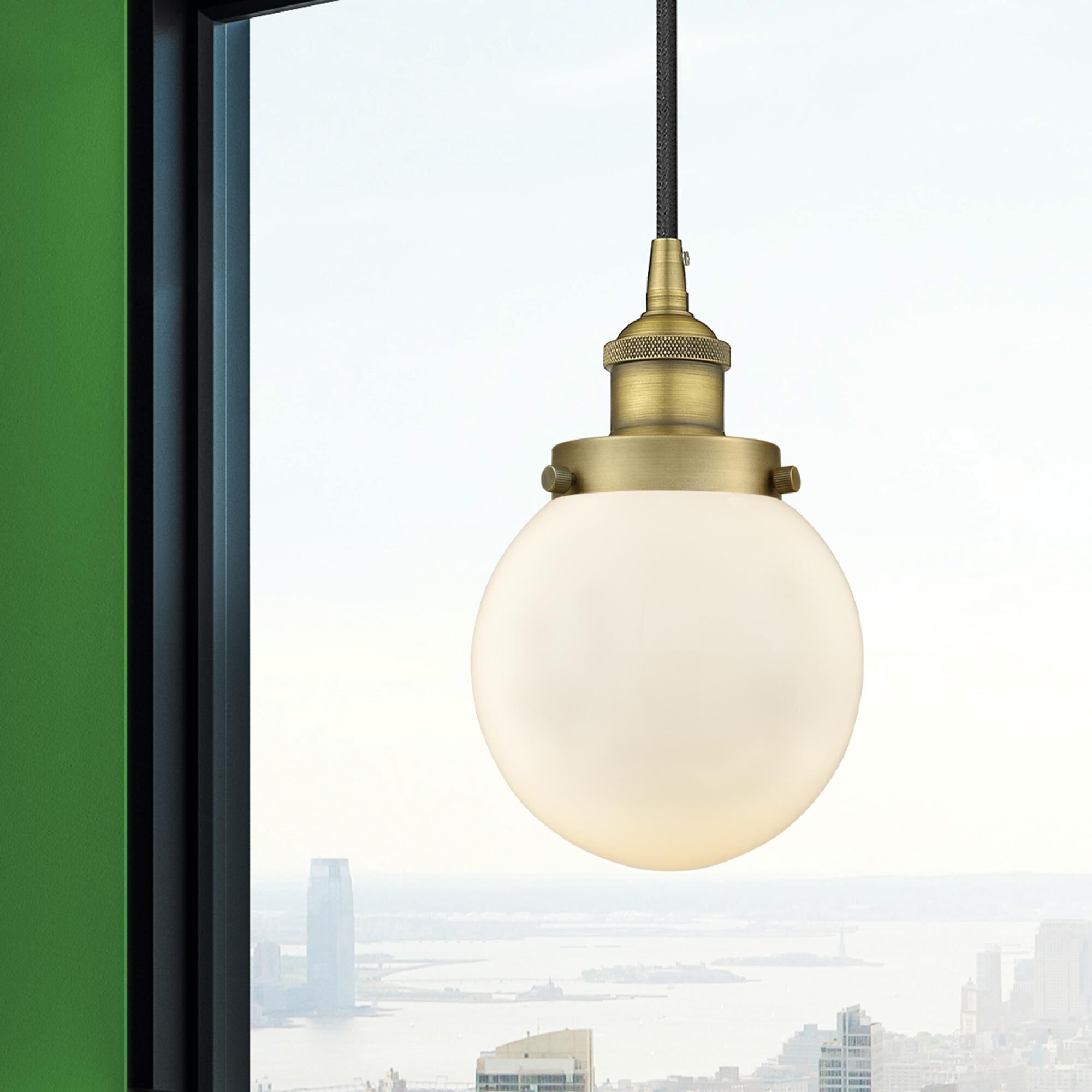 Shown in Brushed Brass finish and Matte White glass