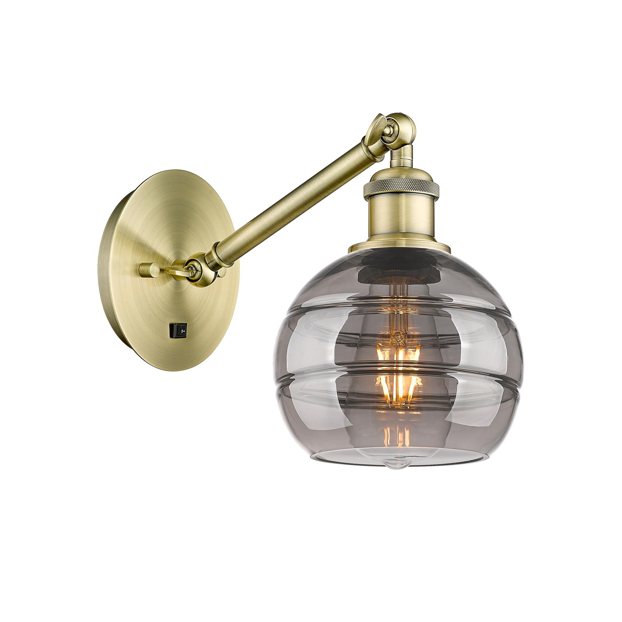 Shown in Antique Brass finish and Light Smoke glass