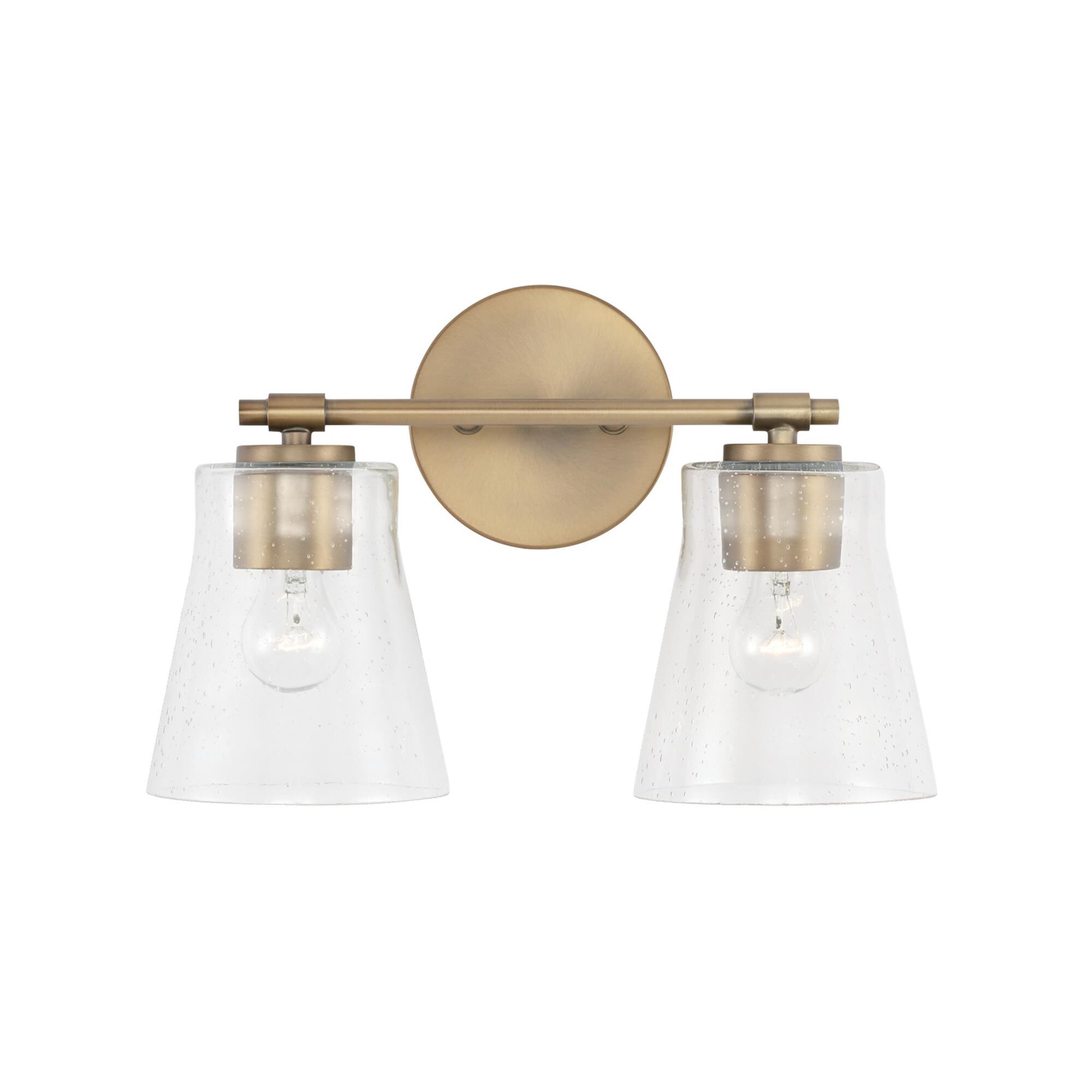 Shown in Aged Brass finish and Clear Seeded glass