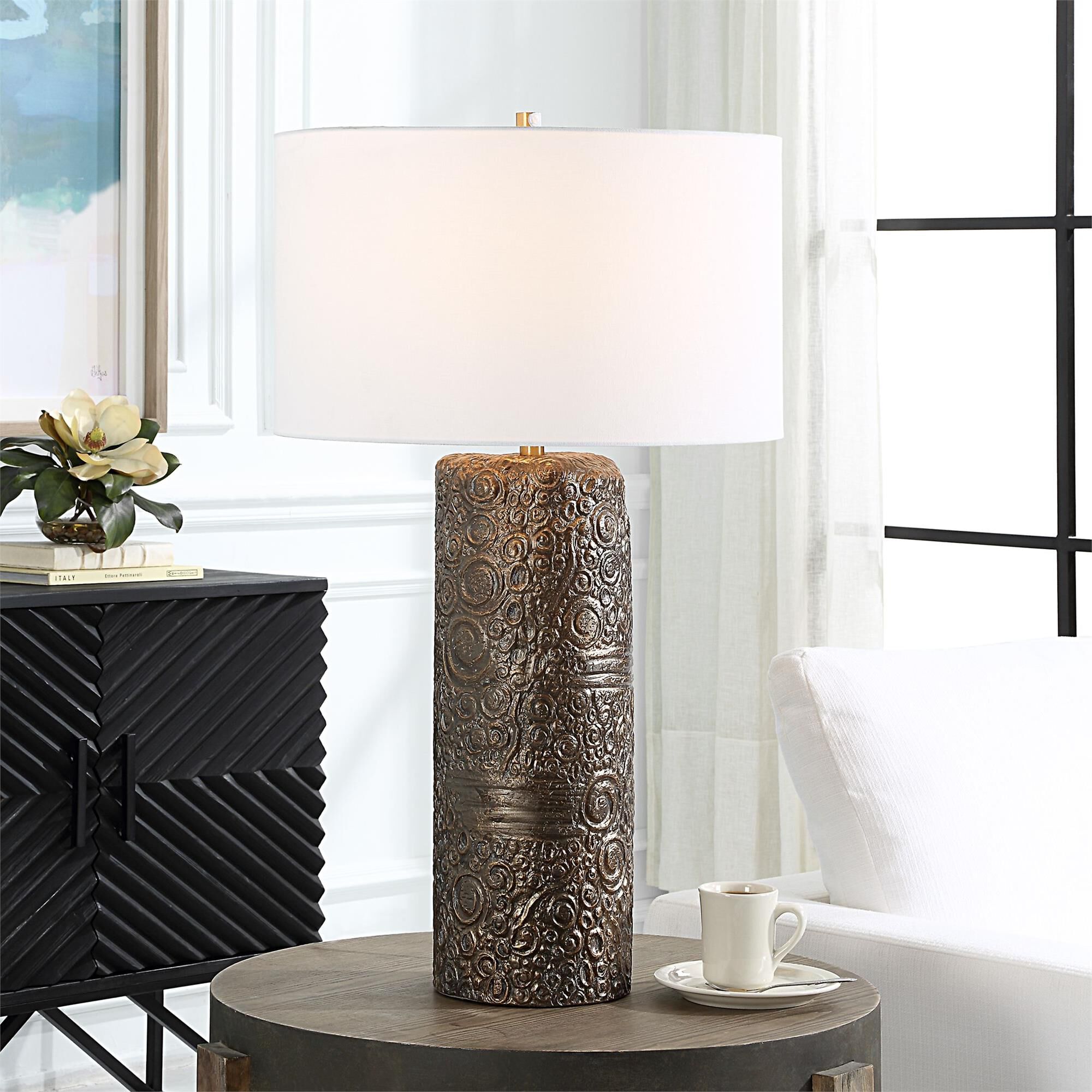 Shown in Transform Your Space With The Charm Of Nostalgia Embodied In Our Ceramic Table Lamp. Its Whimsical C finish and Round Drum Hardback shade