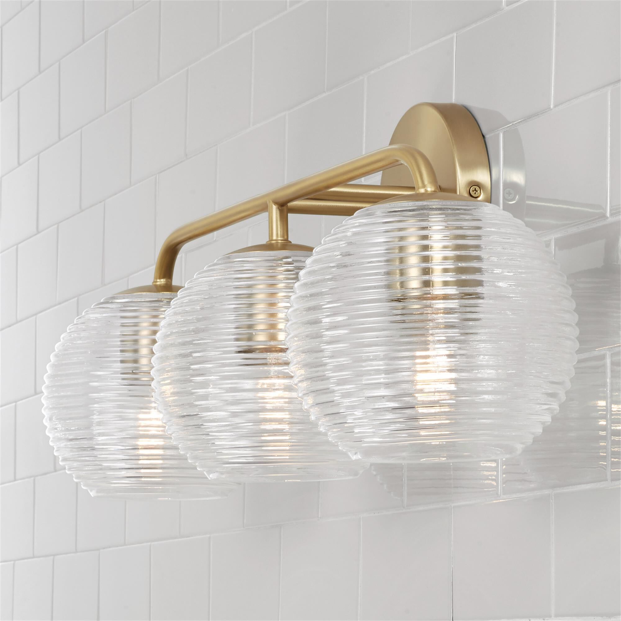 Shown in Matte Brass finish and Clear Ribbed glass