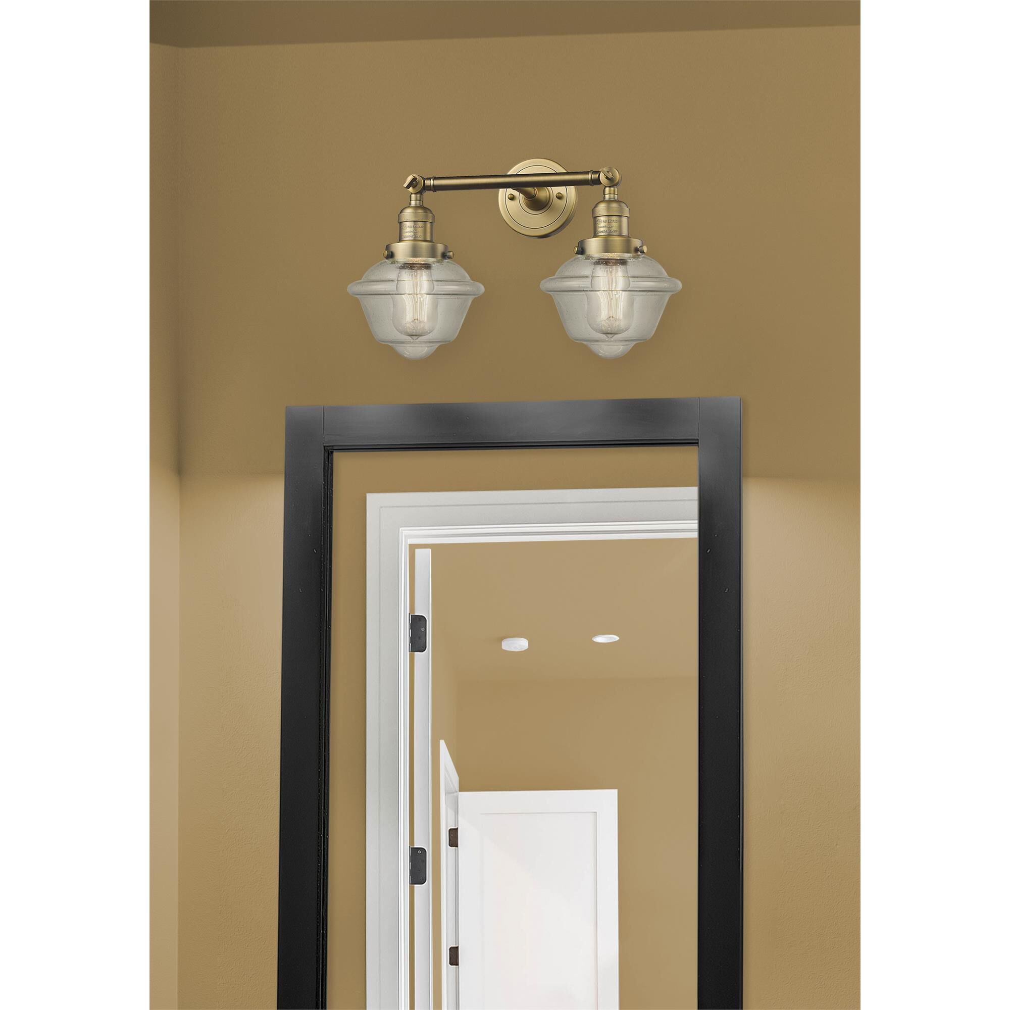 Shown in Brushed Brass finish and Seedy glass