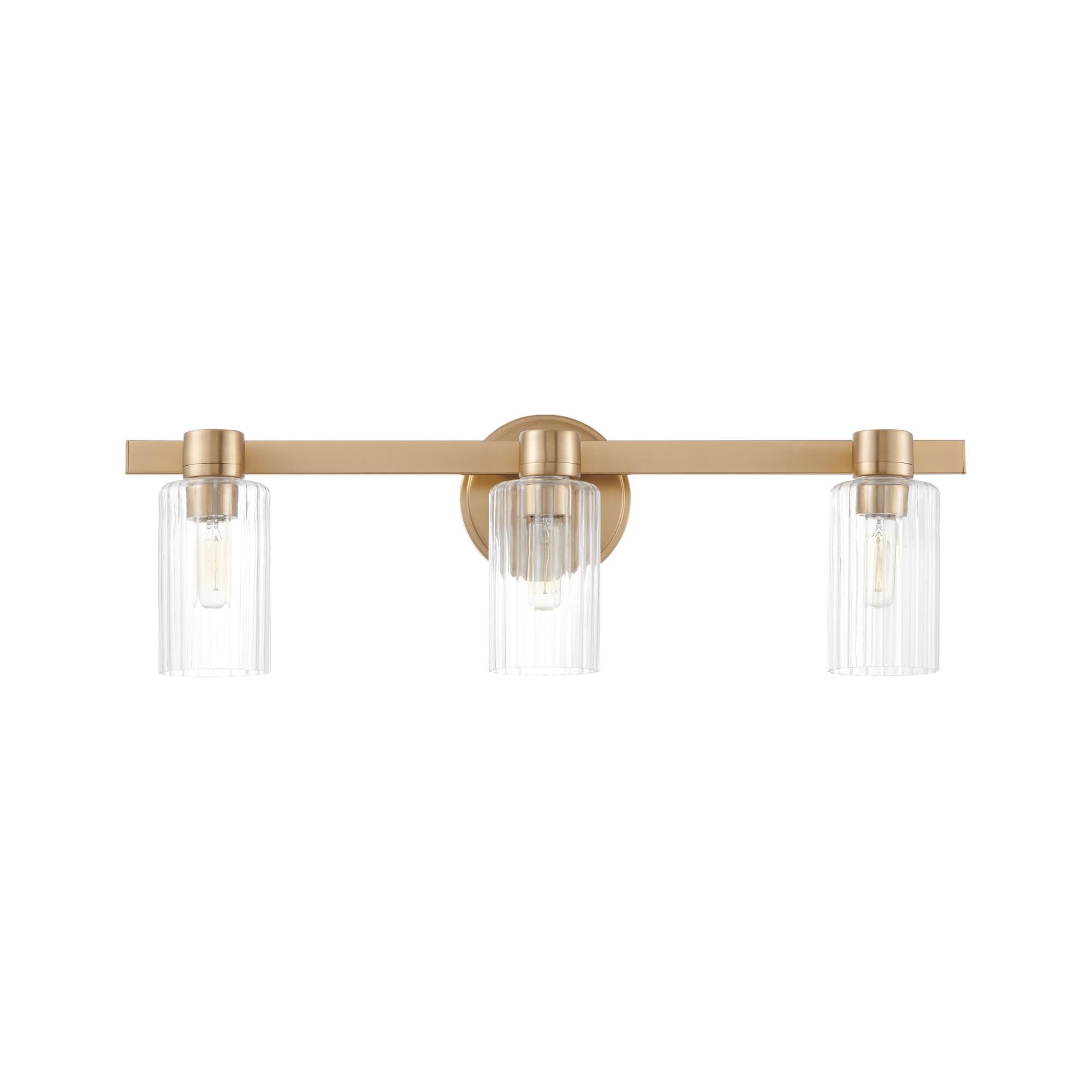 Shown in Champagne Gold finish and Clear Ribbed glass