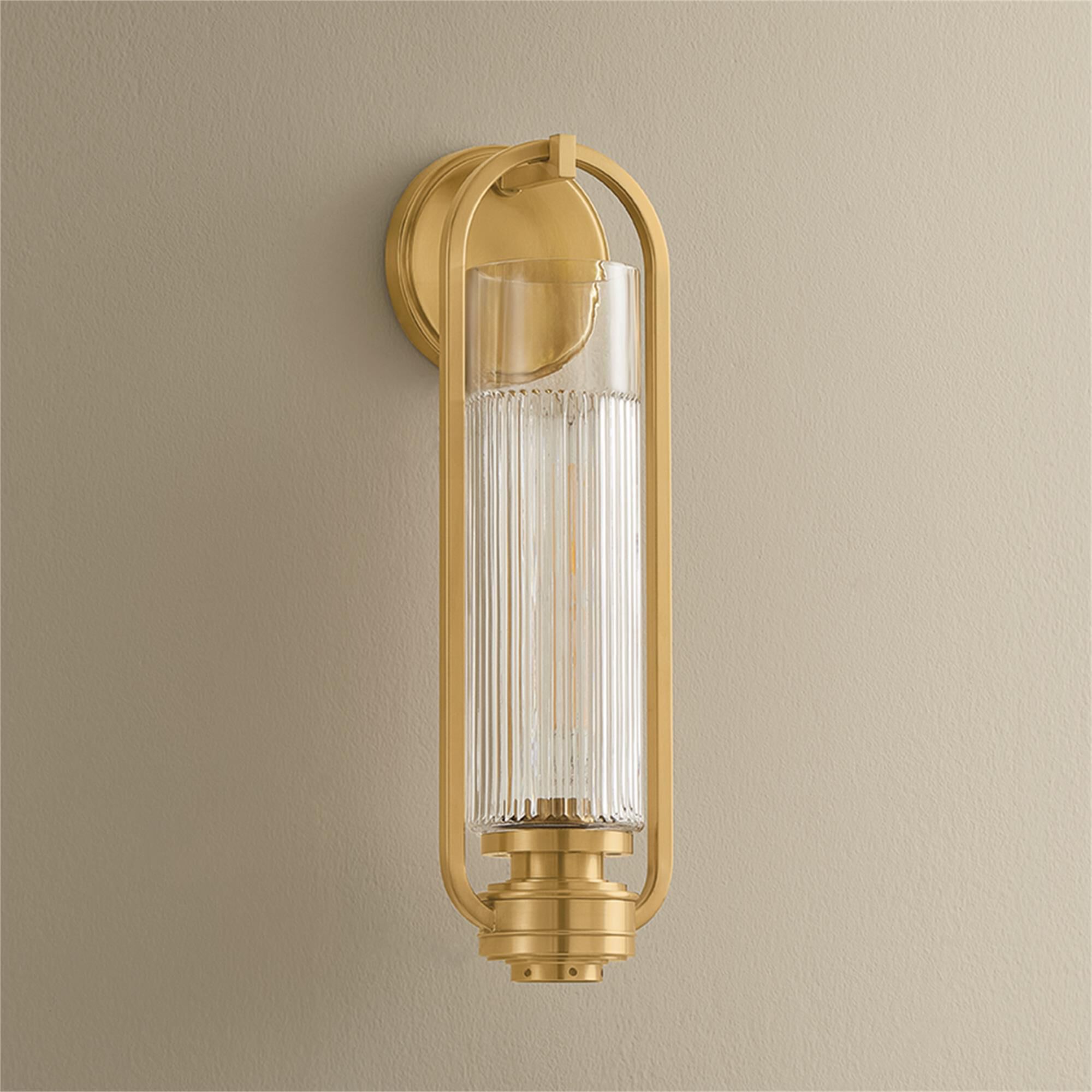 Shown in Aged Brass finish and Clear Optic glass