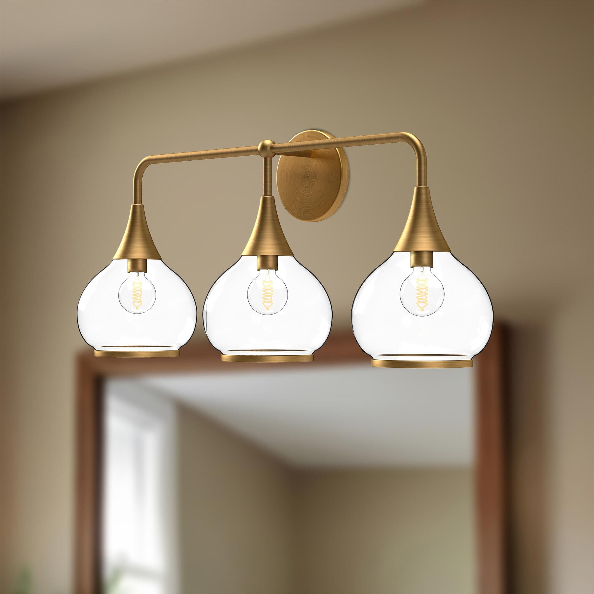 Shown in Aged Gold finish and Clear glass