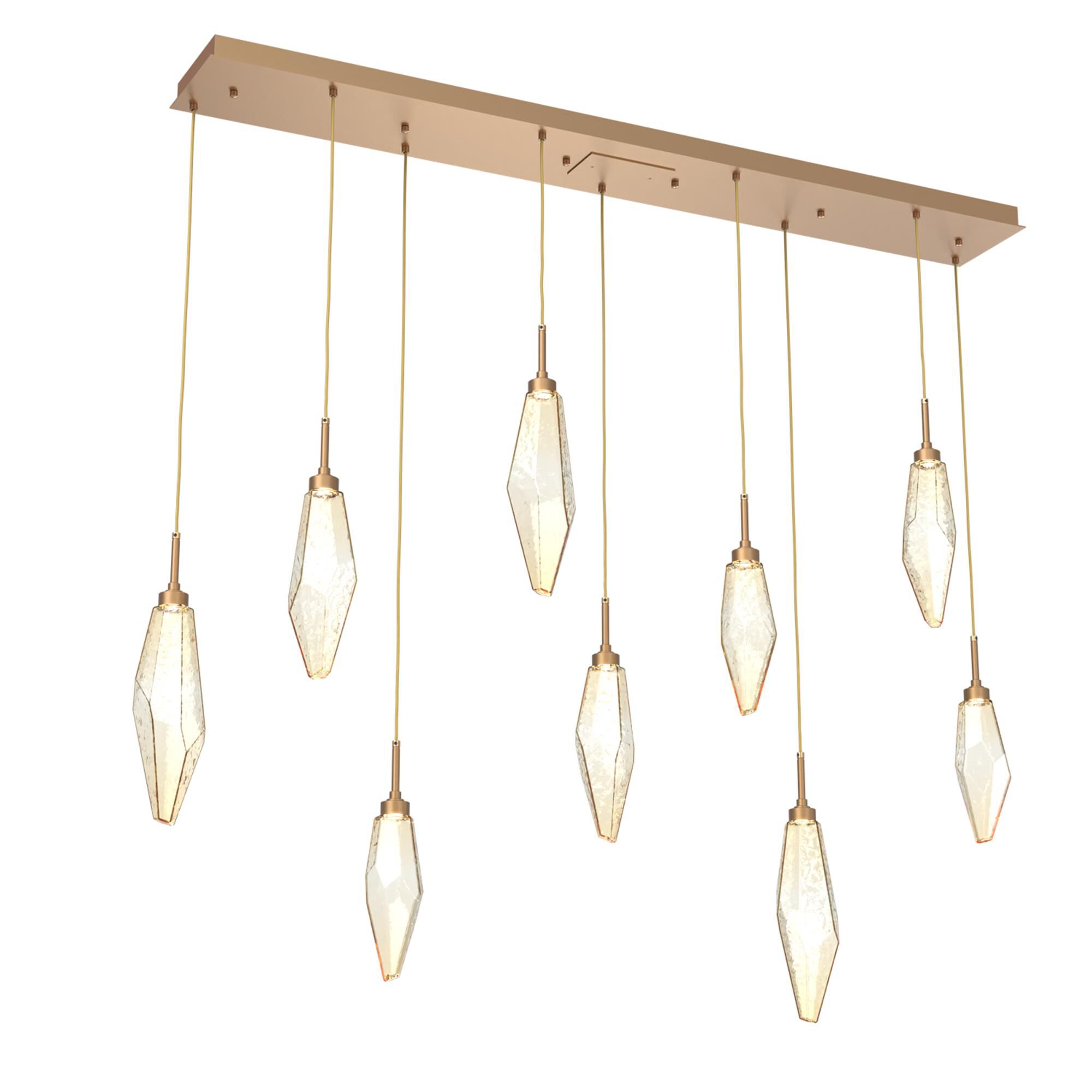 Shown in Novel Brass finish and Chilled Blown And Amber glass
