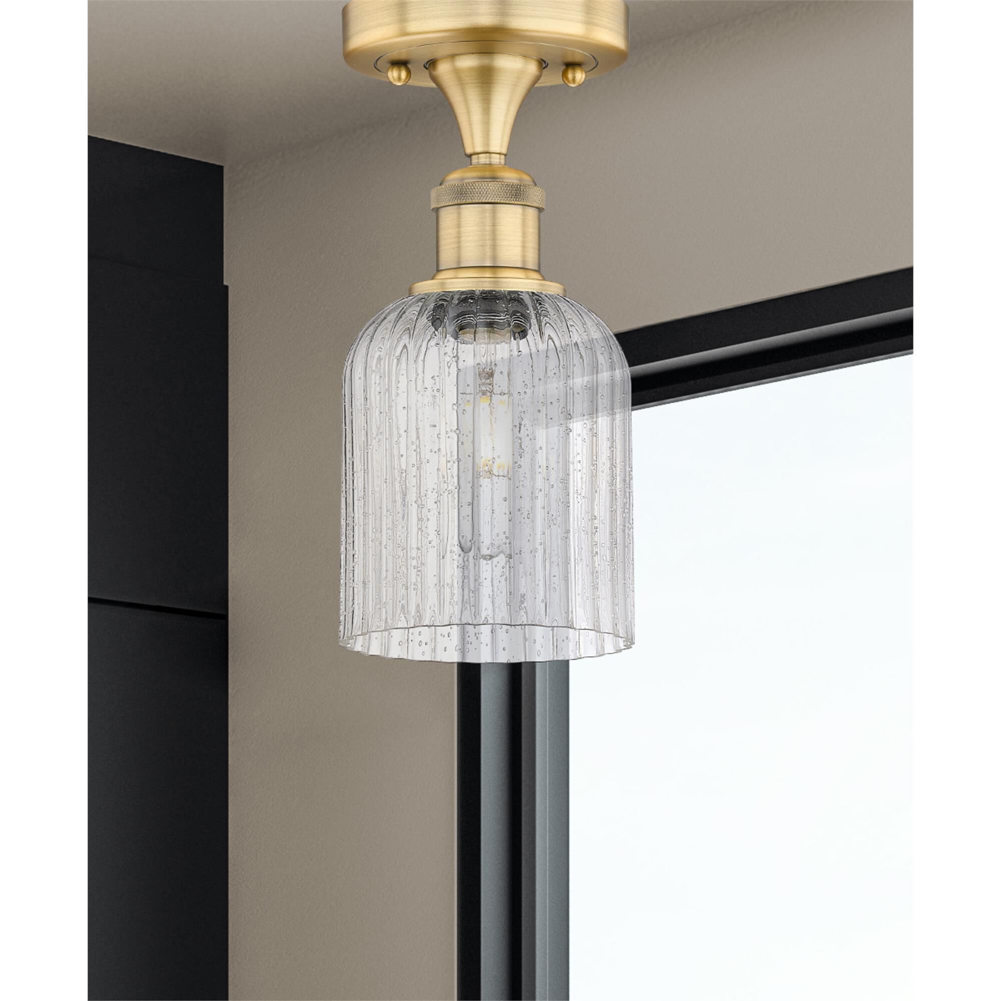 Shown in Brushed Brass finish and Seedy glass
