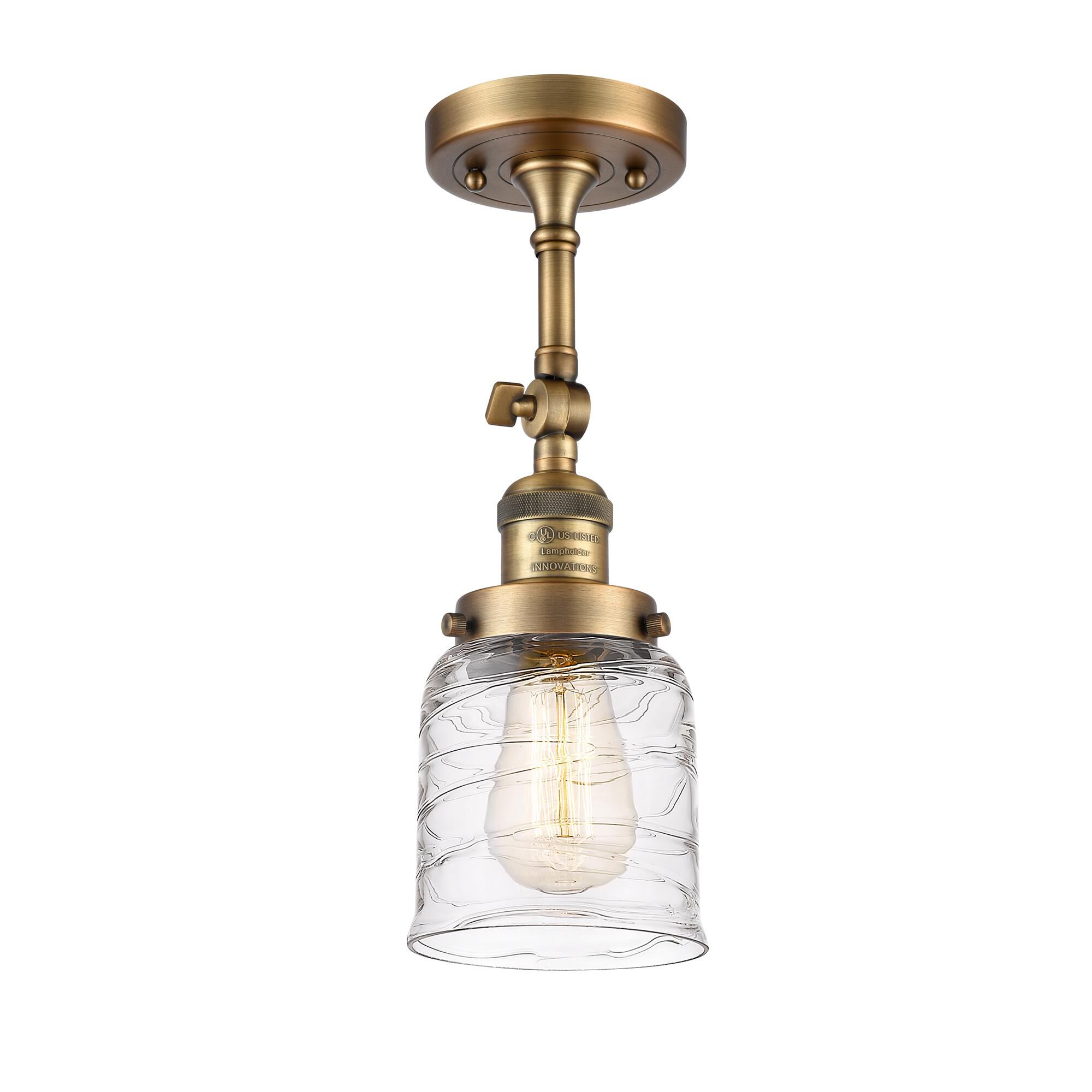 Shown in Brushed Brass finish and Clear Deco Swirl Small Bell glass