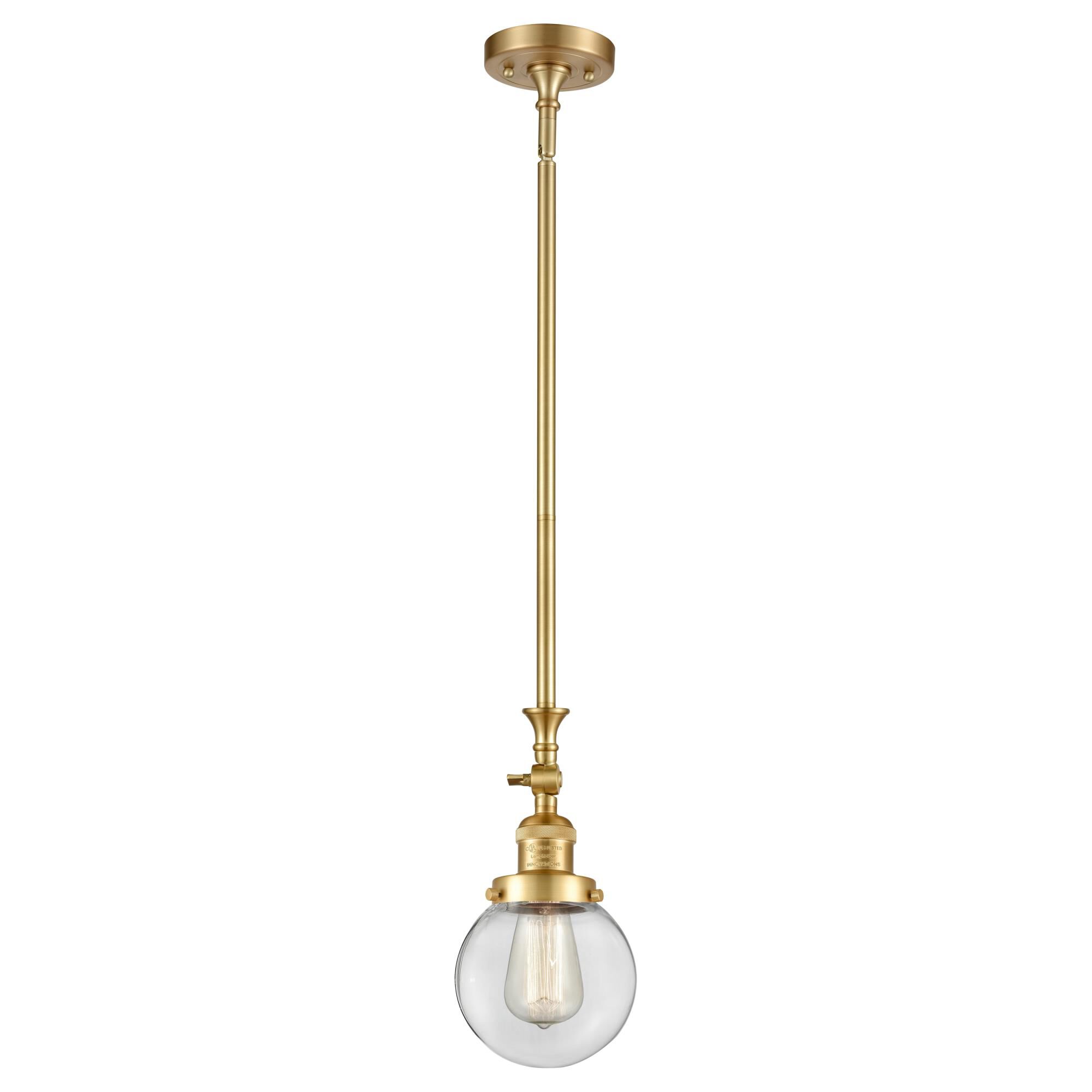 Shown in Satin Gold finish and Clear Beacon glass