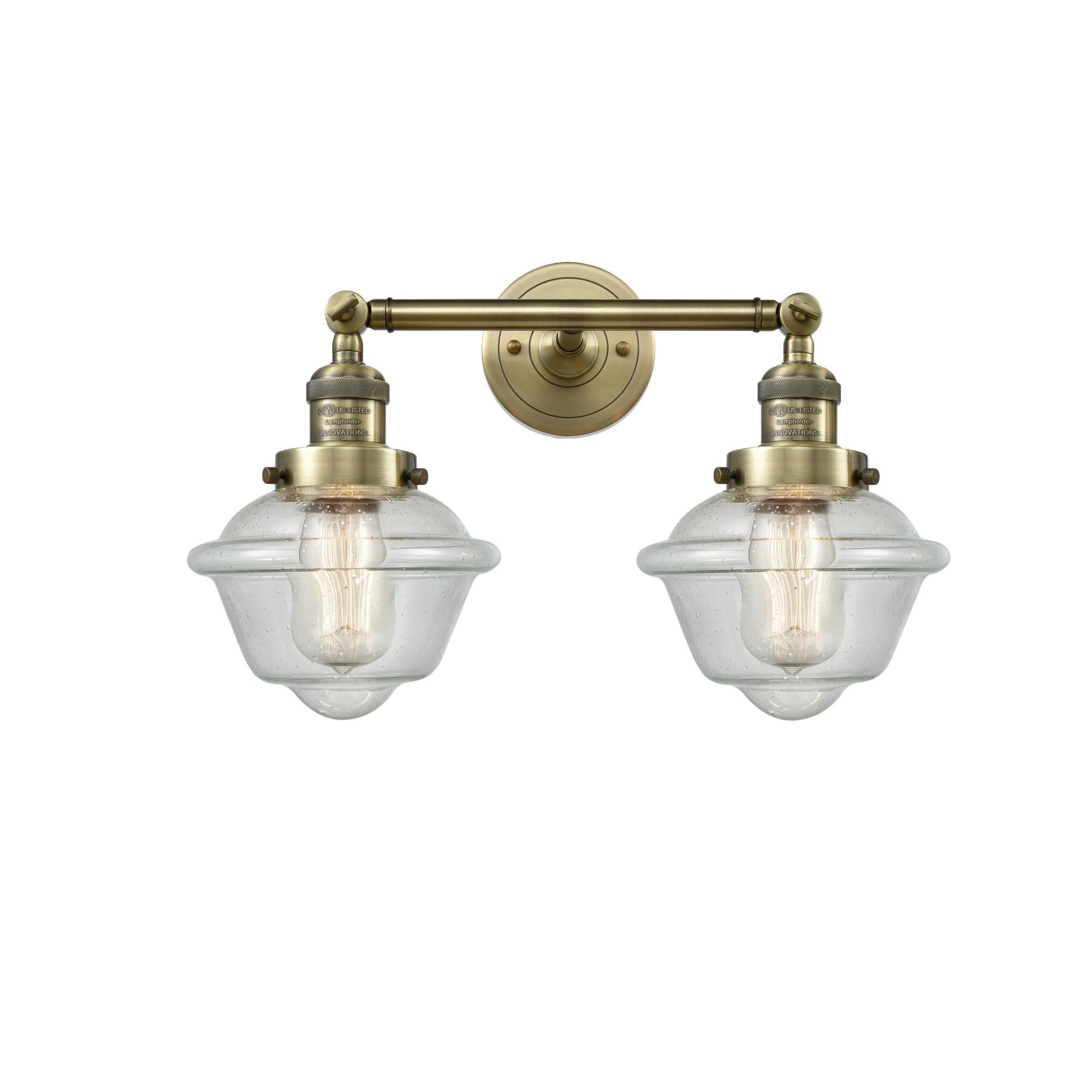 Shown in Antique Brass finish and Seedy glass