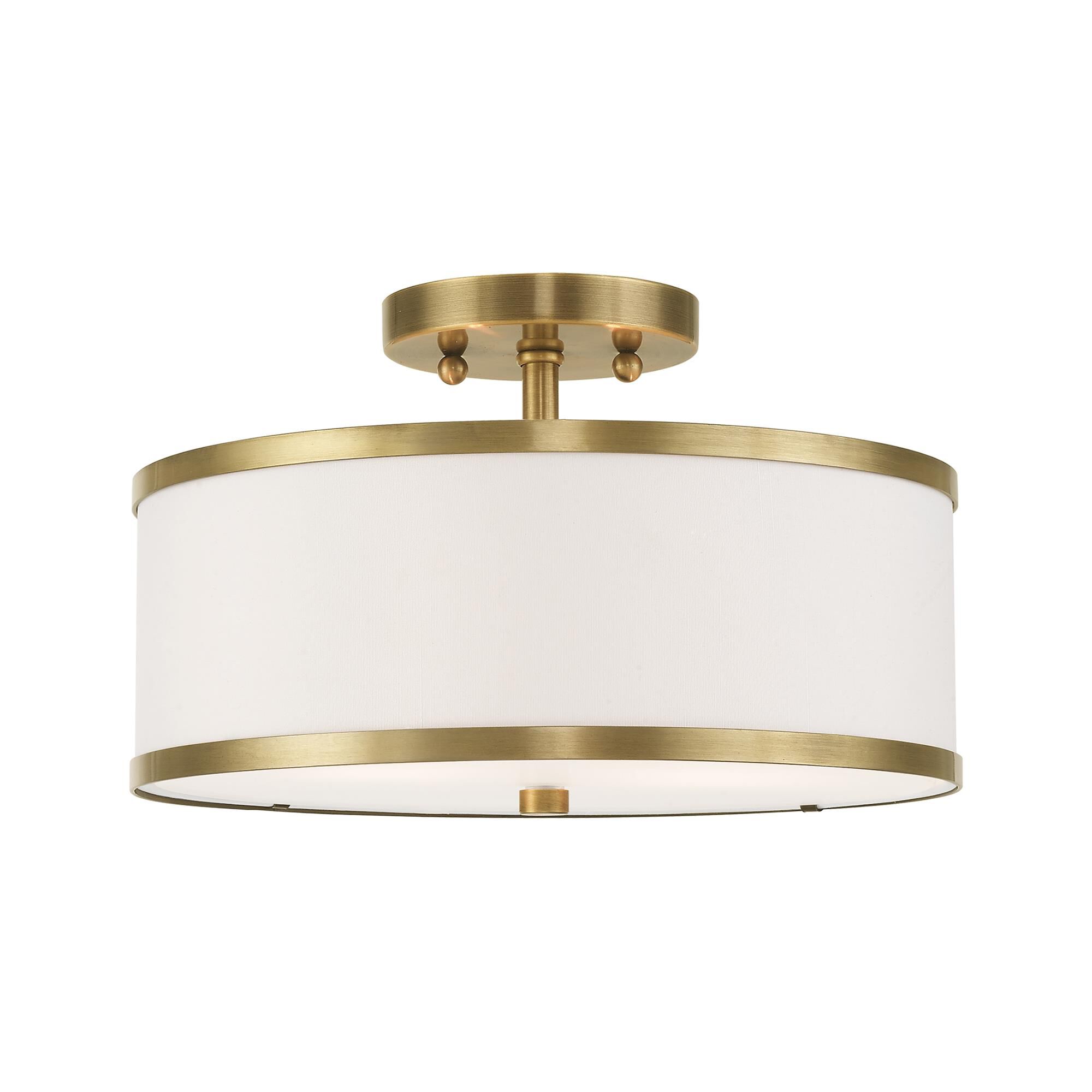 Shown in Antique Brass finish and Hand Crafted Off-White Fabric Hardback shade