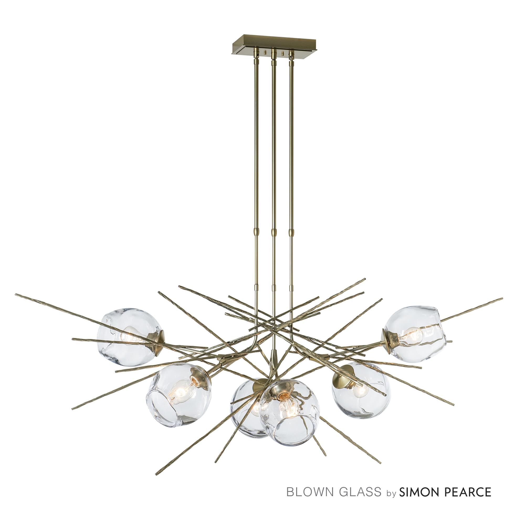 Shown in Modern Brass finish and Clear shade