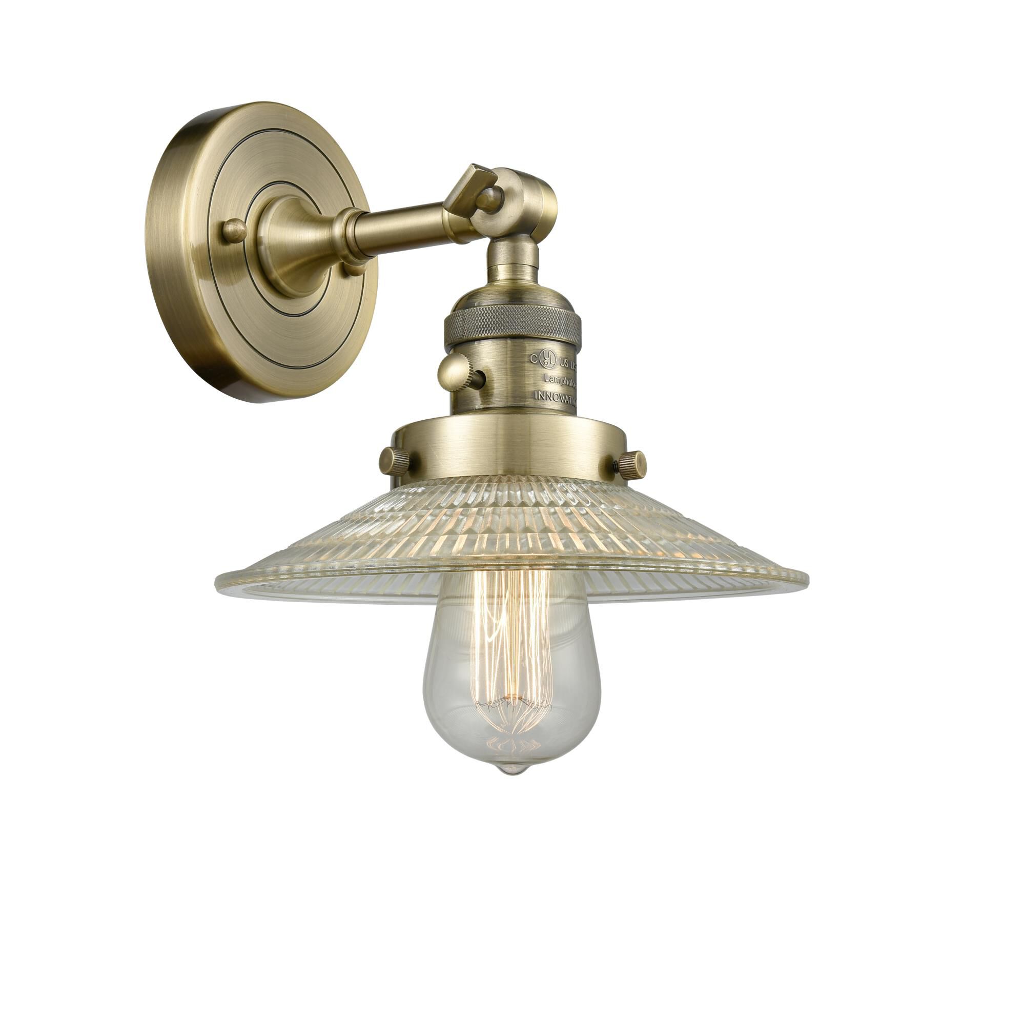 Shown in Antique Brass finish and Clear Halophane glass and Switch on Socket accent