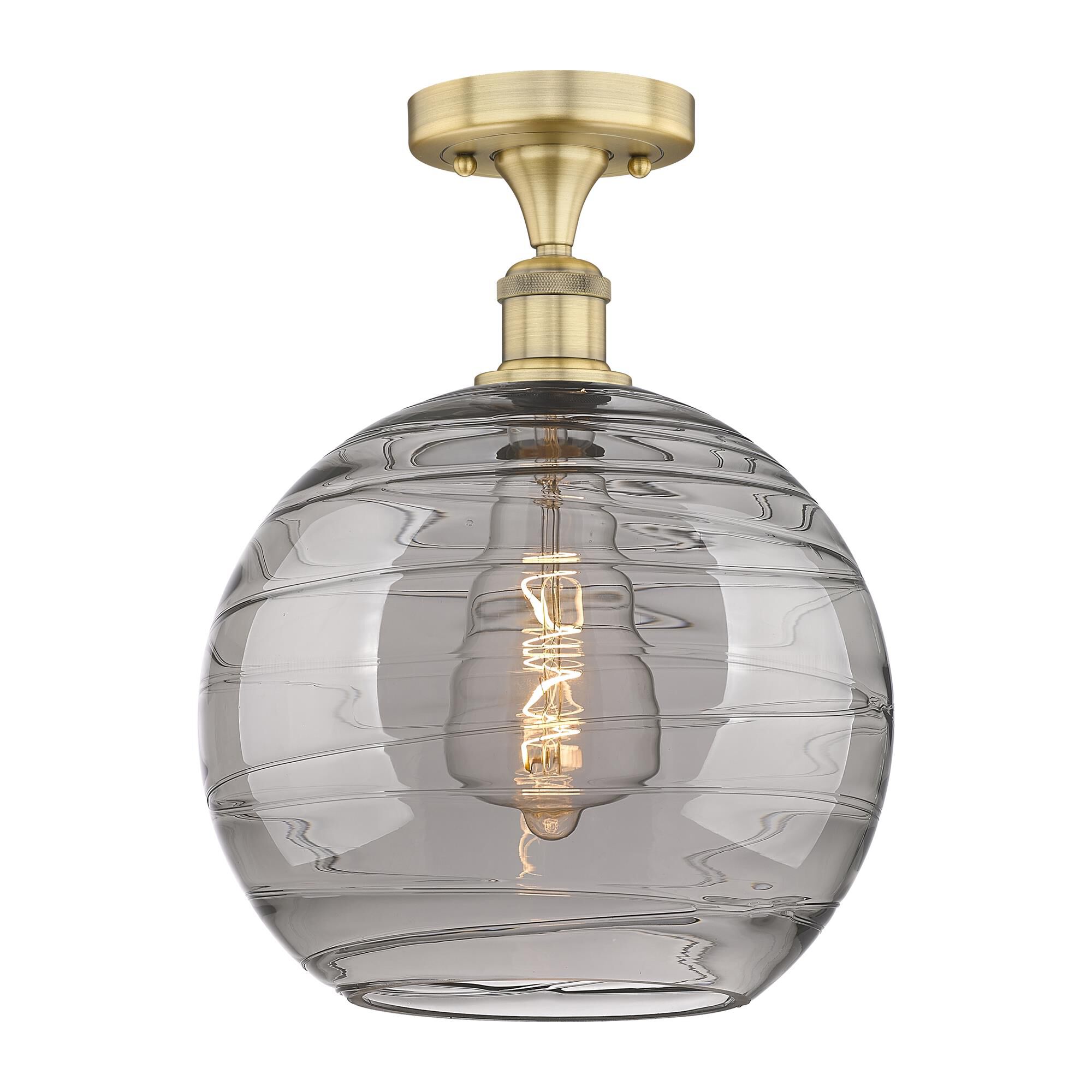 Shown in Brushed Brass finish and Light Smoke Deco Swirl glass