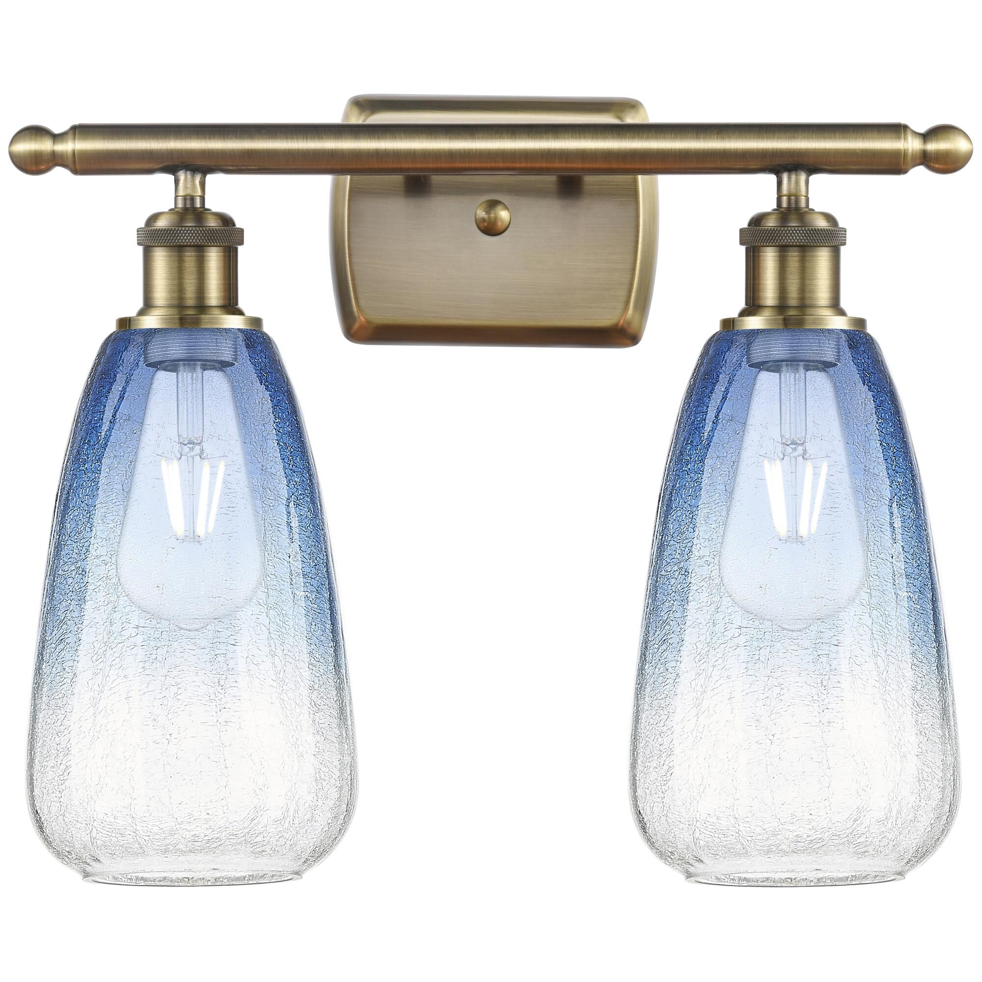 Shown in Antique Brass finish and Sapphire Blue glass