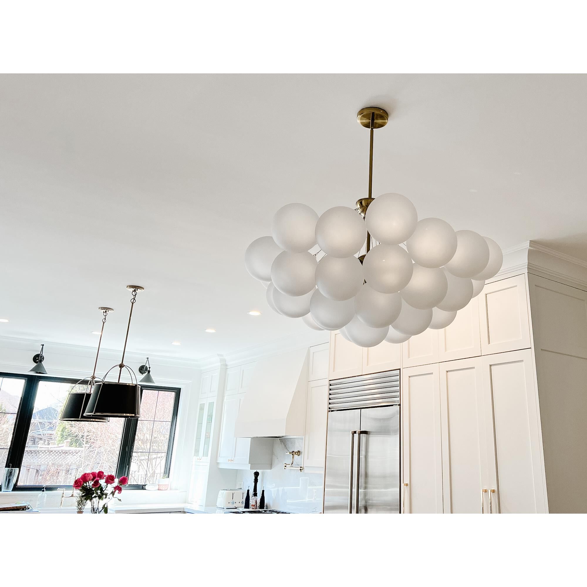 Shown in White and Aged Brass finish and White Globe glass