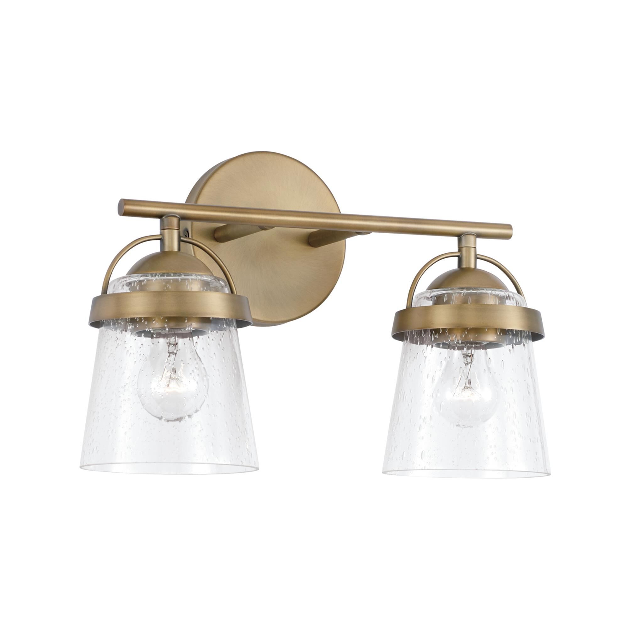 Shown in Aged Brass finish and Clear Seeded glass