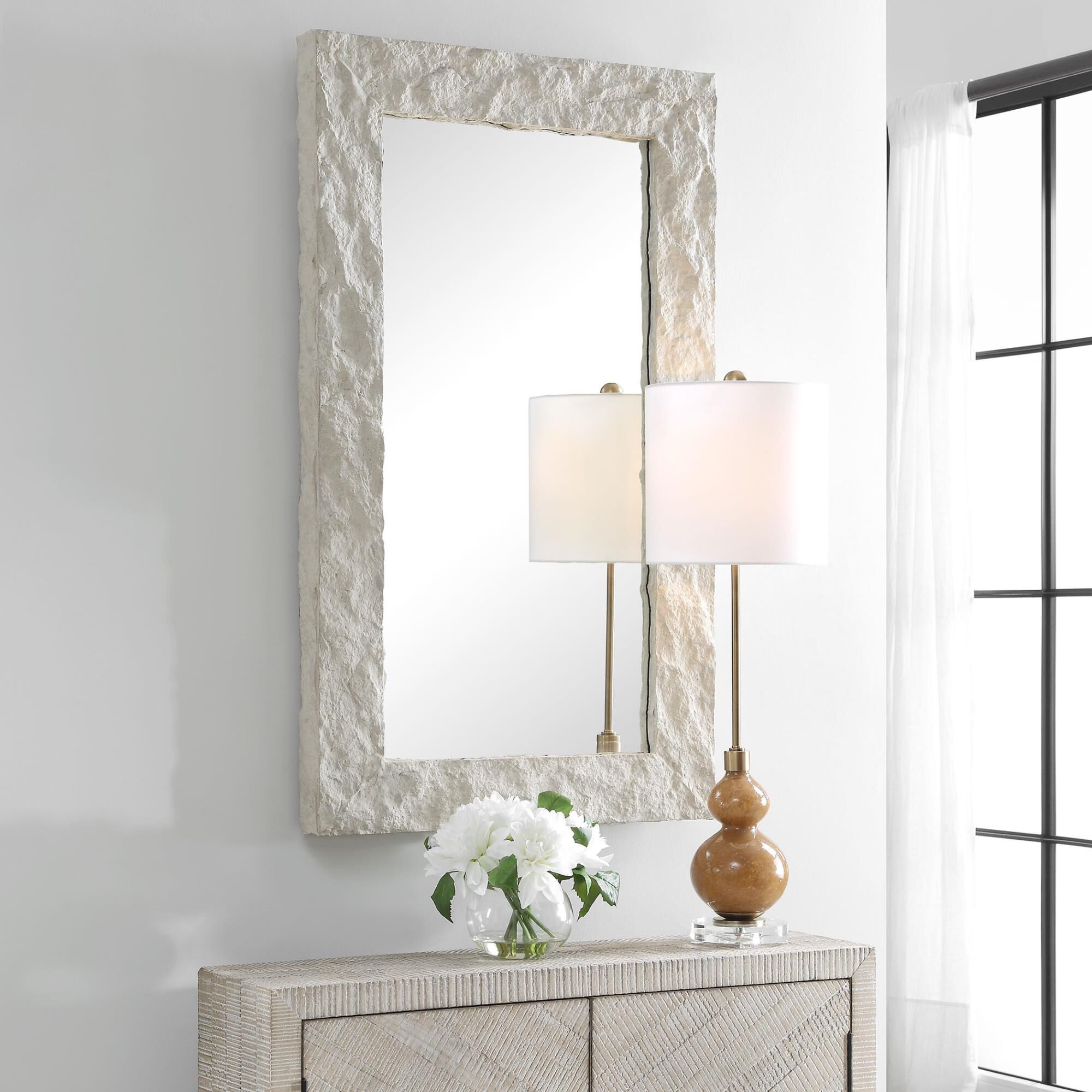 Shown in Elevate Your Decor With Rustic Charm And Upscale Elegance. Our Quarry Rectangle Mirror Showcases A M finish
