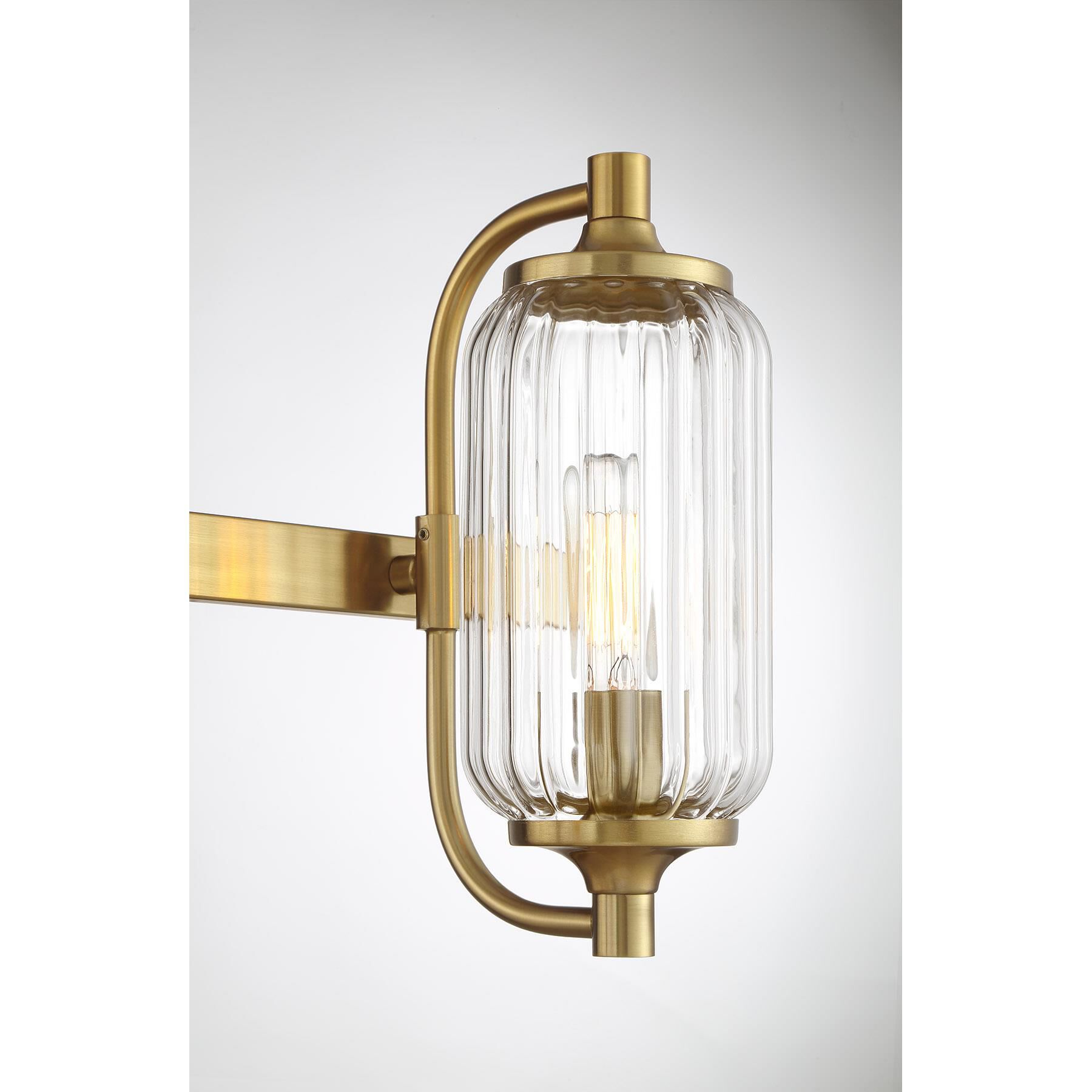 Shown in Warm Brass finish and Clear Ribbed glass