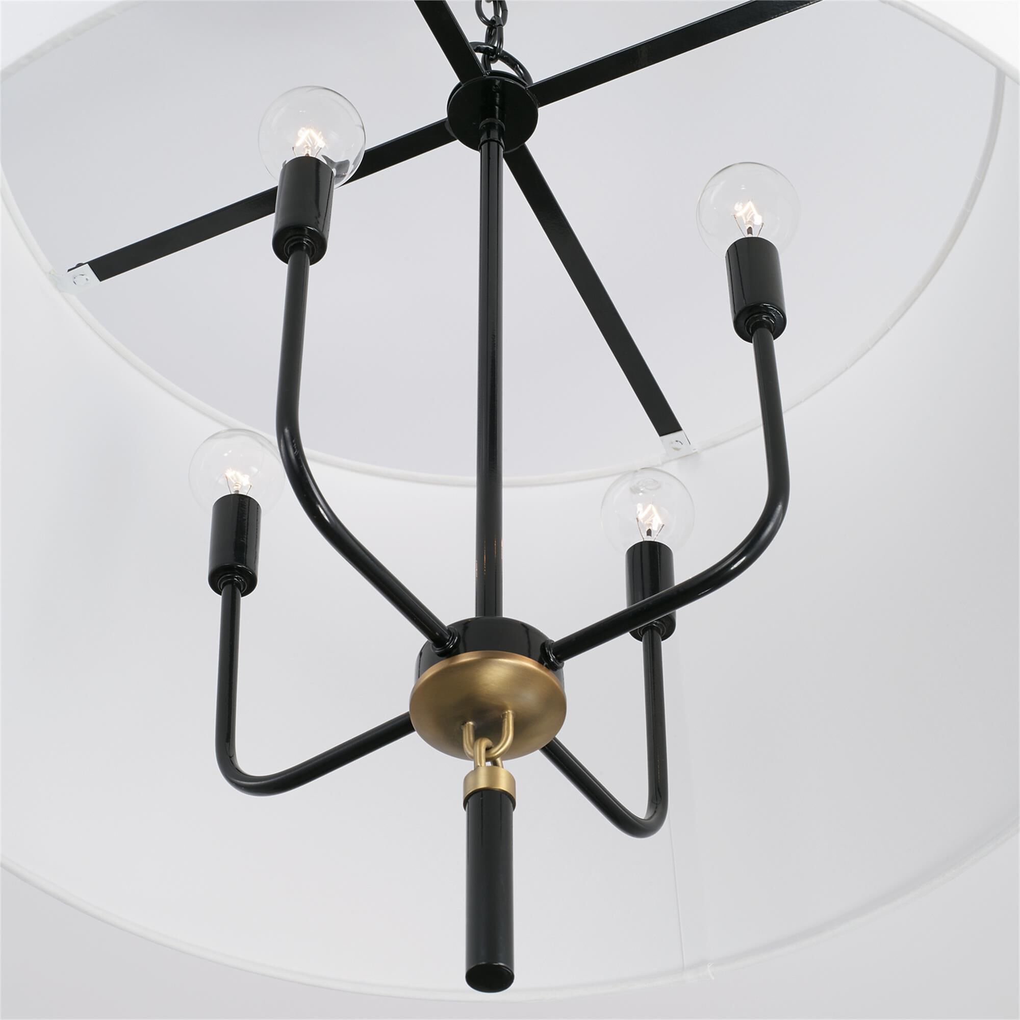 Shown in Glossy Black And Aged Brass finish and White Fabric shade