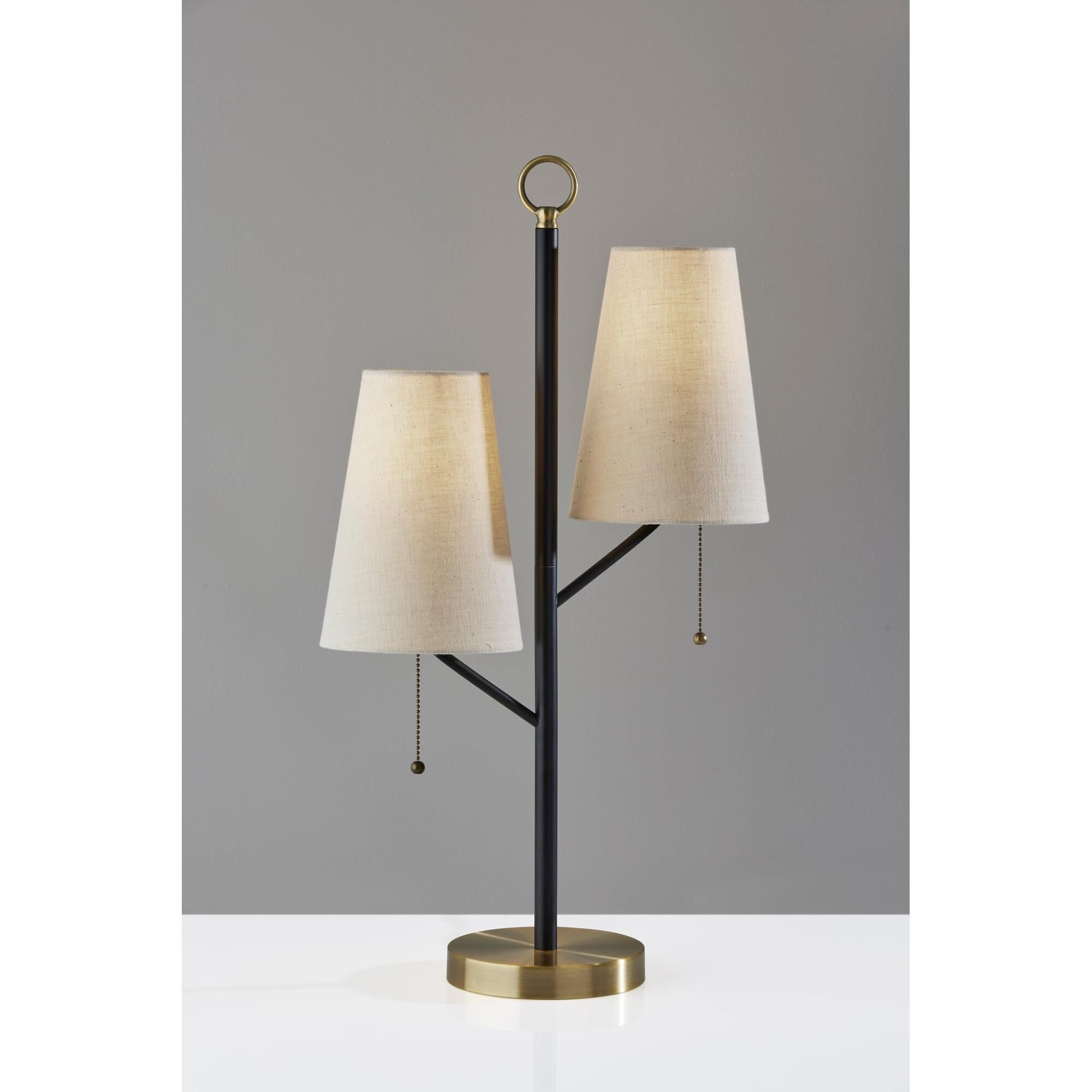 Shown in Black W. Antique Brass Accents finish and Cream Textured Fabric shade