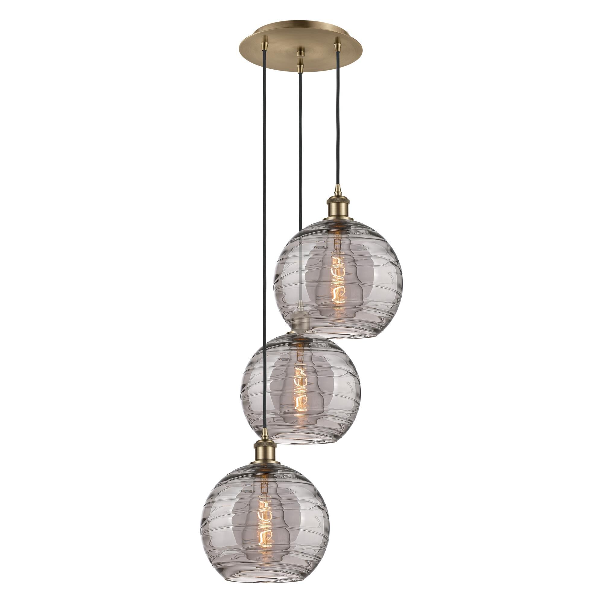 Shown in Antique Brass finish and Light Smoke Deco Swirl glass