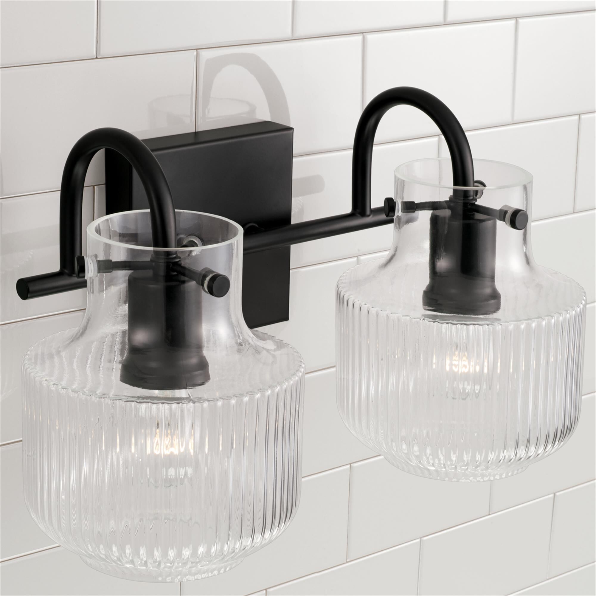 Shown in Matte Black finish and Clear Fluted glass