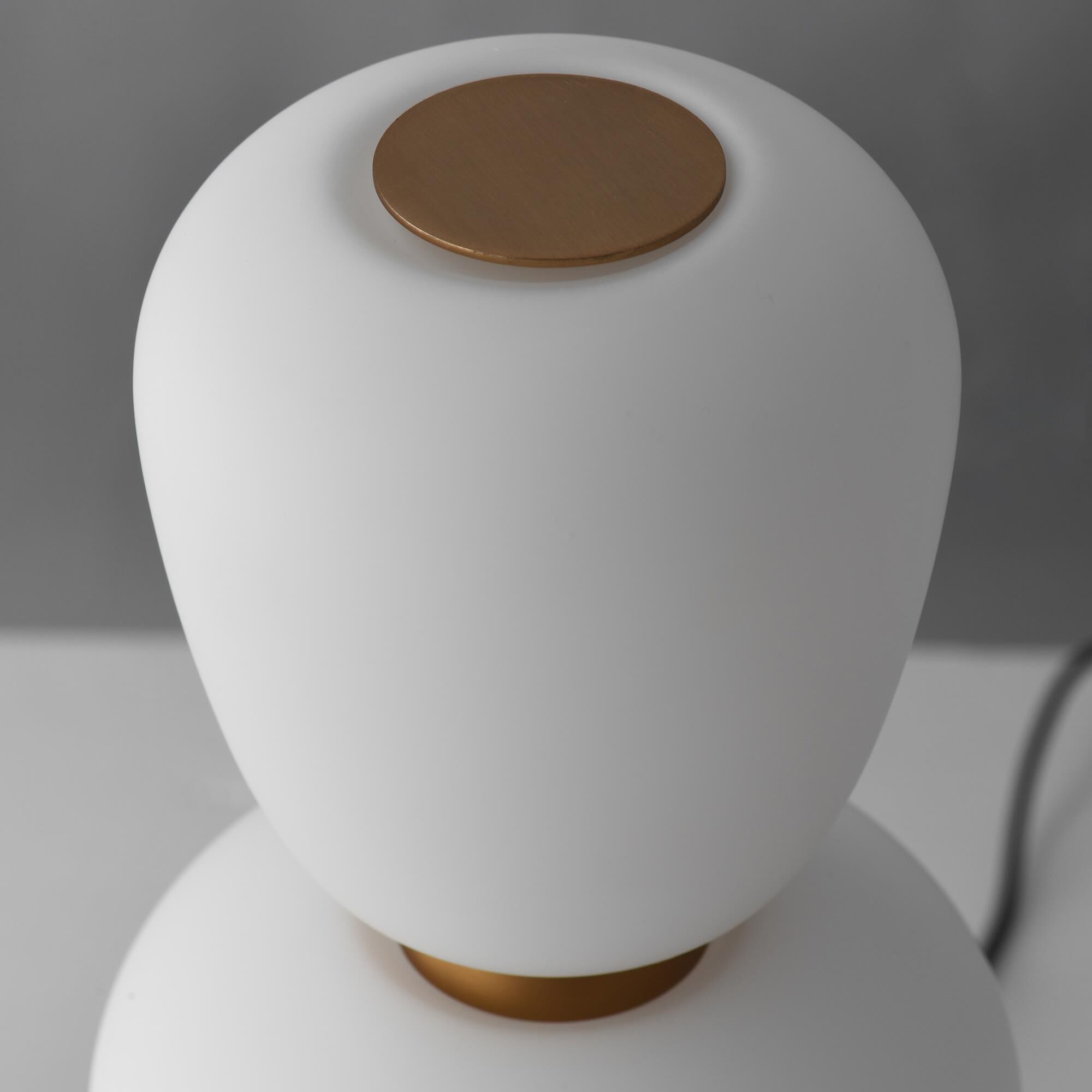 Shown in Black and Gold finish and Satin White glass