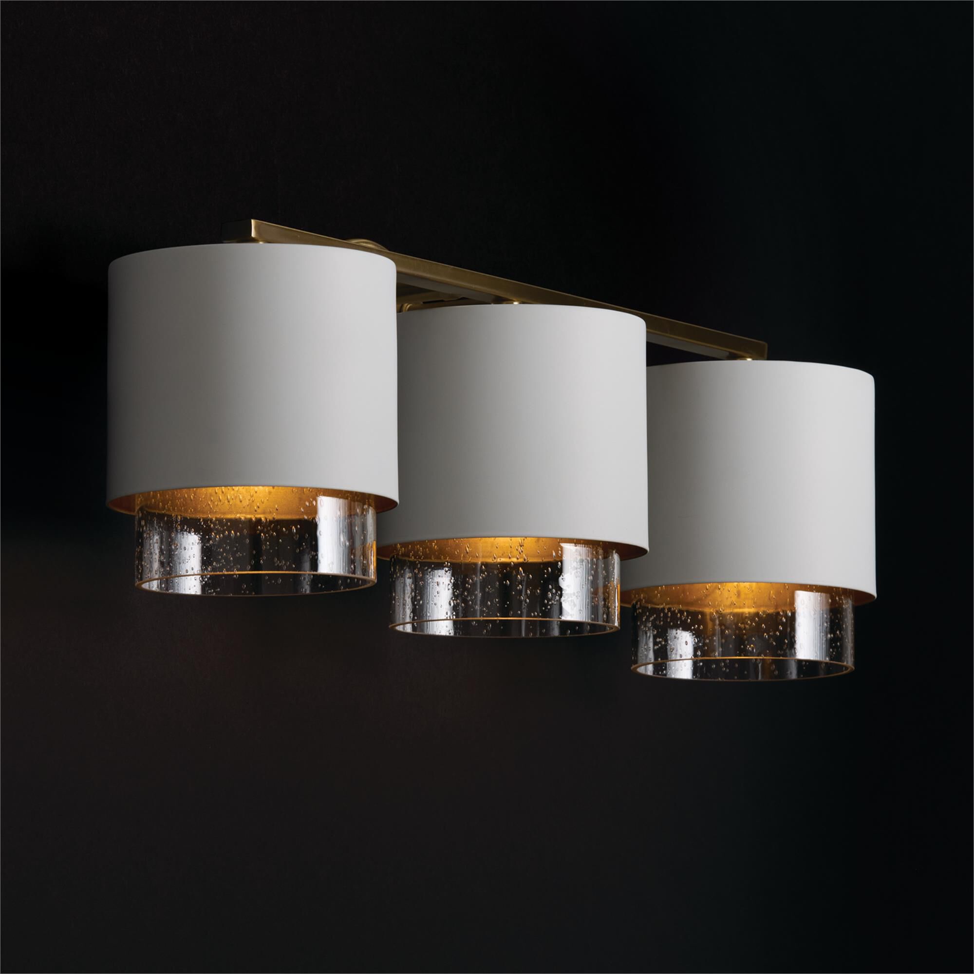 Shown in Matte Brass and White finish and Clear Seeded glass and Metal with Brass Interior shade