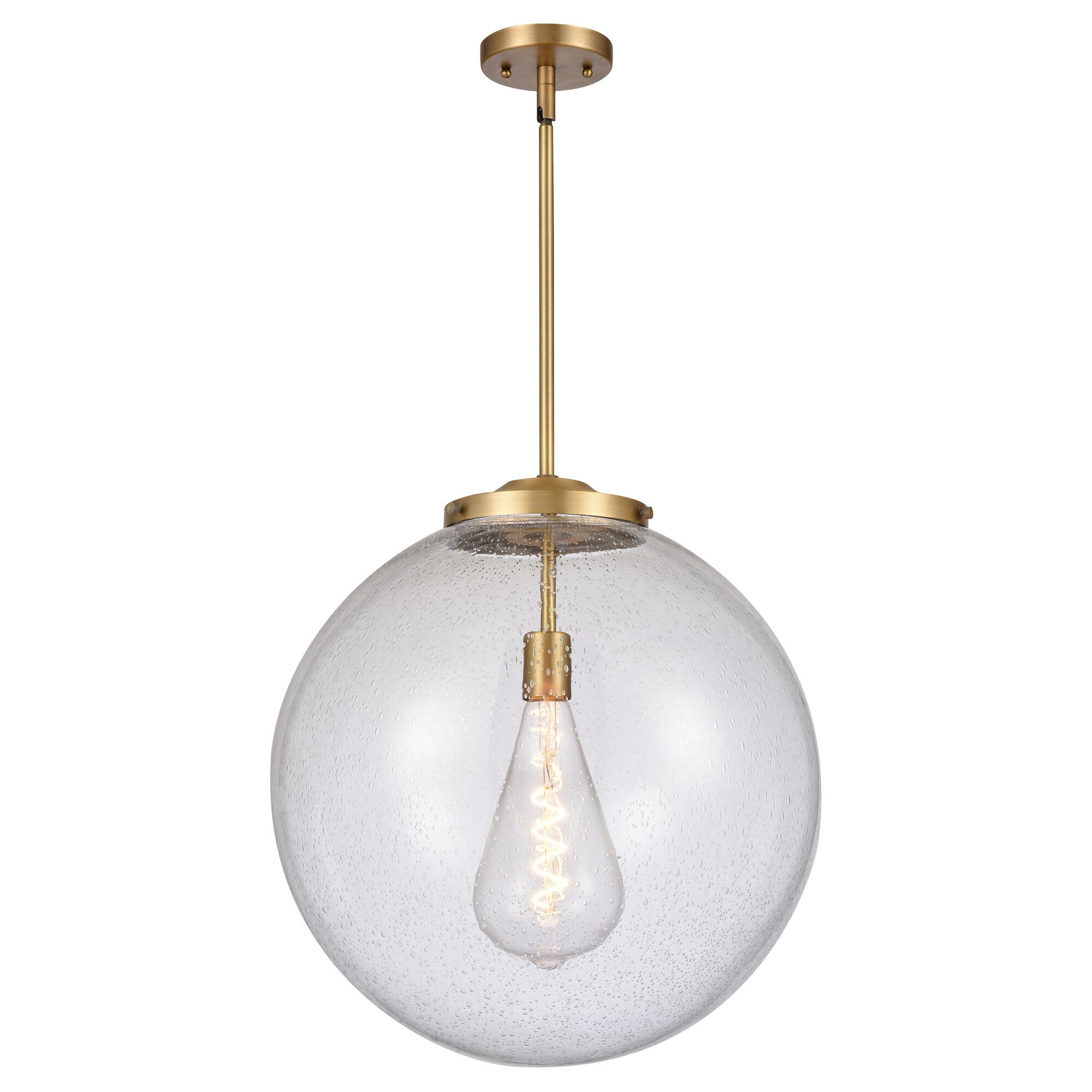 Shown in Brushed Brass finish and Seedy Beacon glass