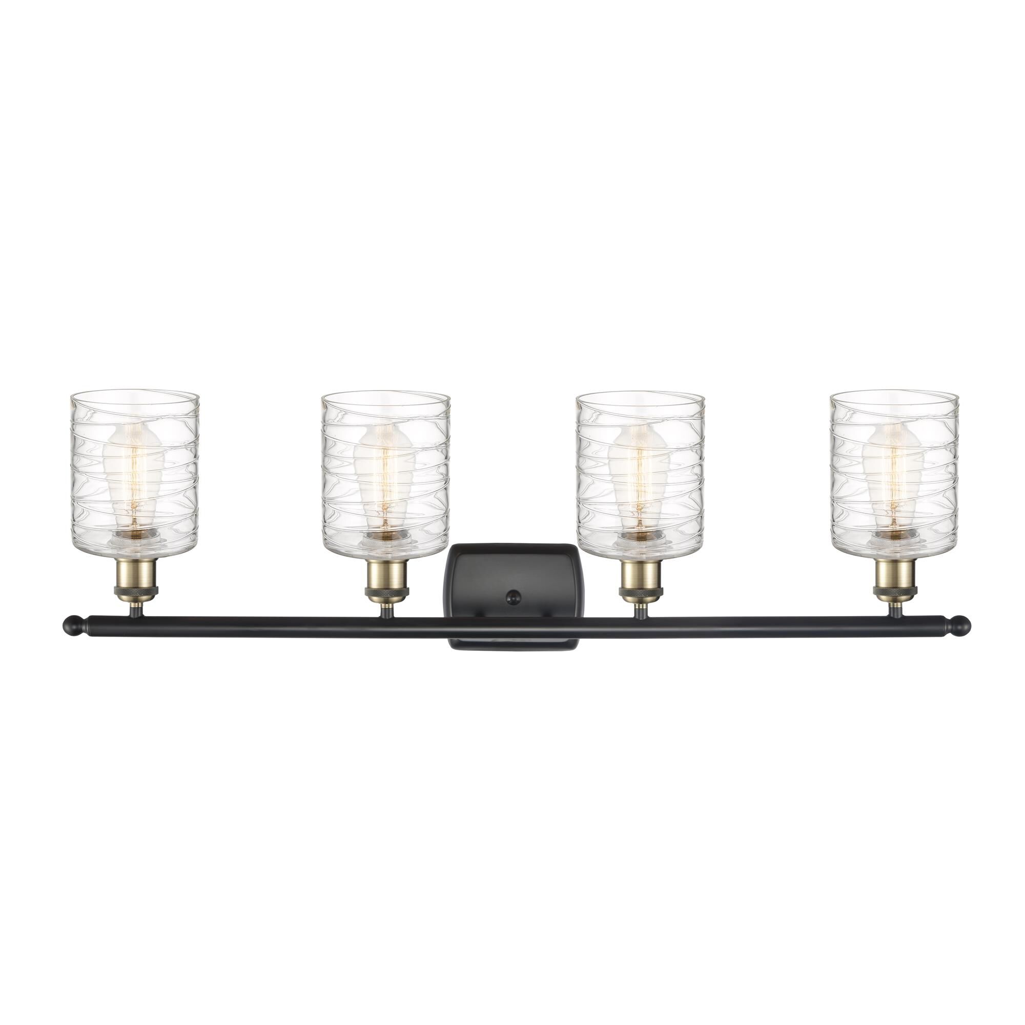 Shown in Black Antique Brass finish and Deco Swirl glass
