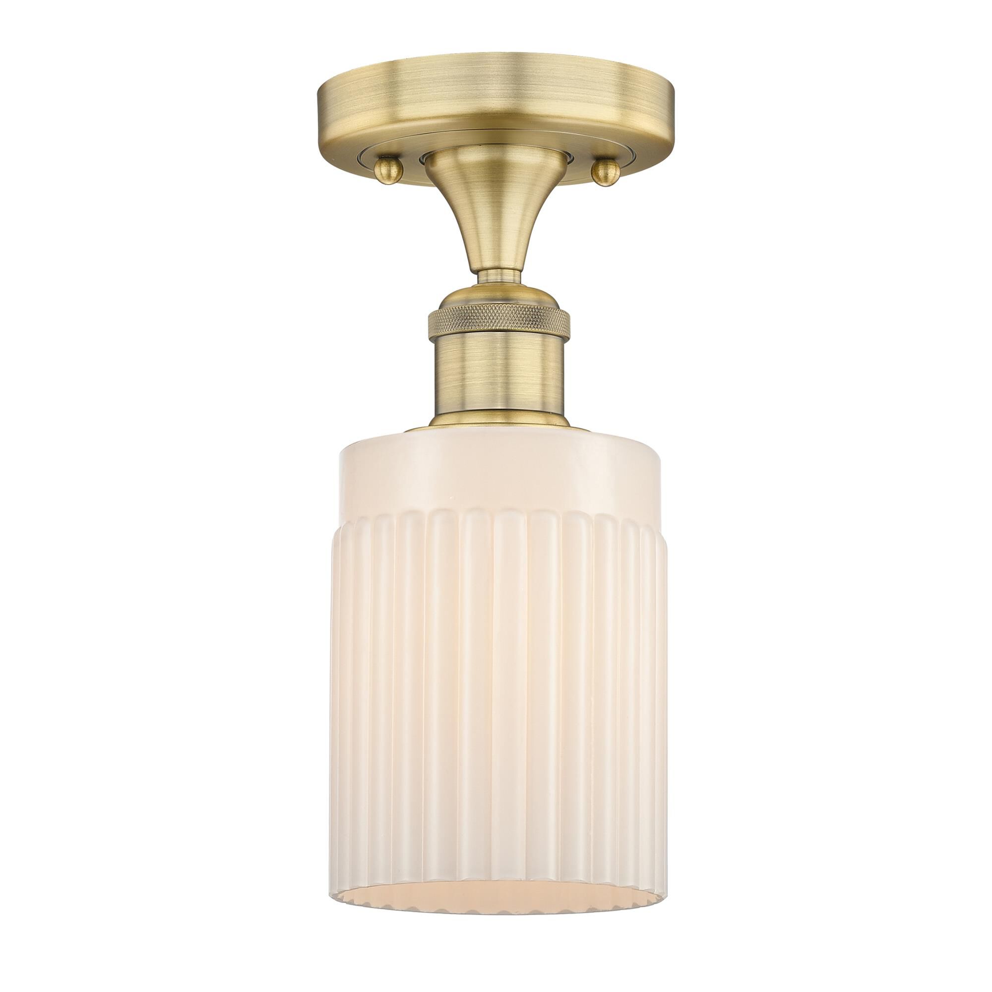 Shown in Brushed Brass finish and Matte White glass
