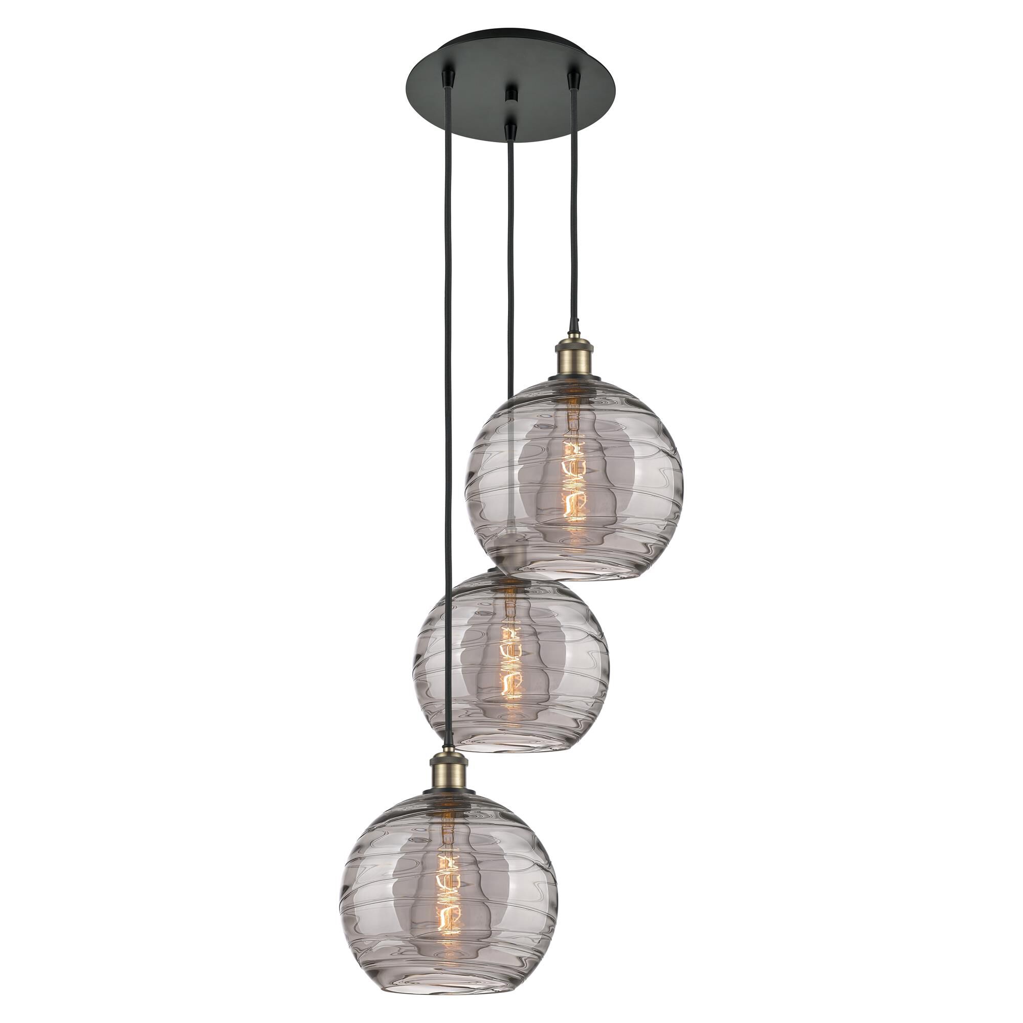 Shown in Black Antique Brass finish and Light Smoke Deco Swirl glass