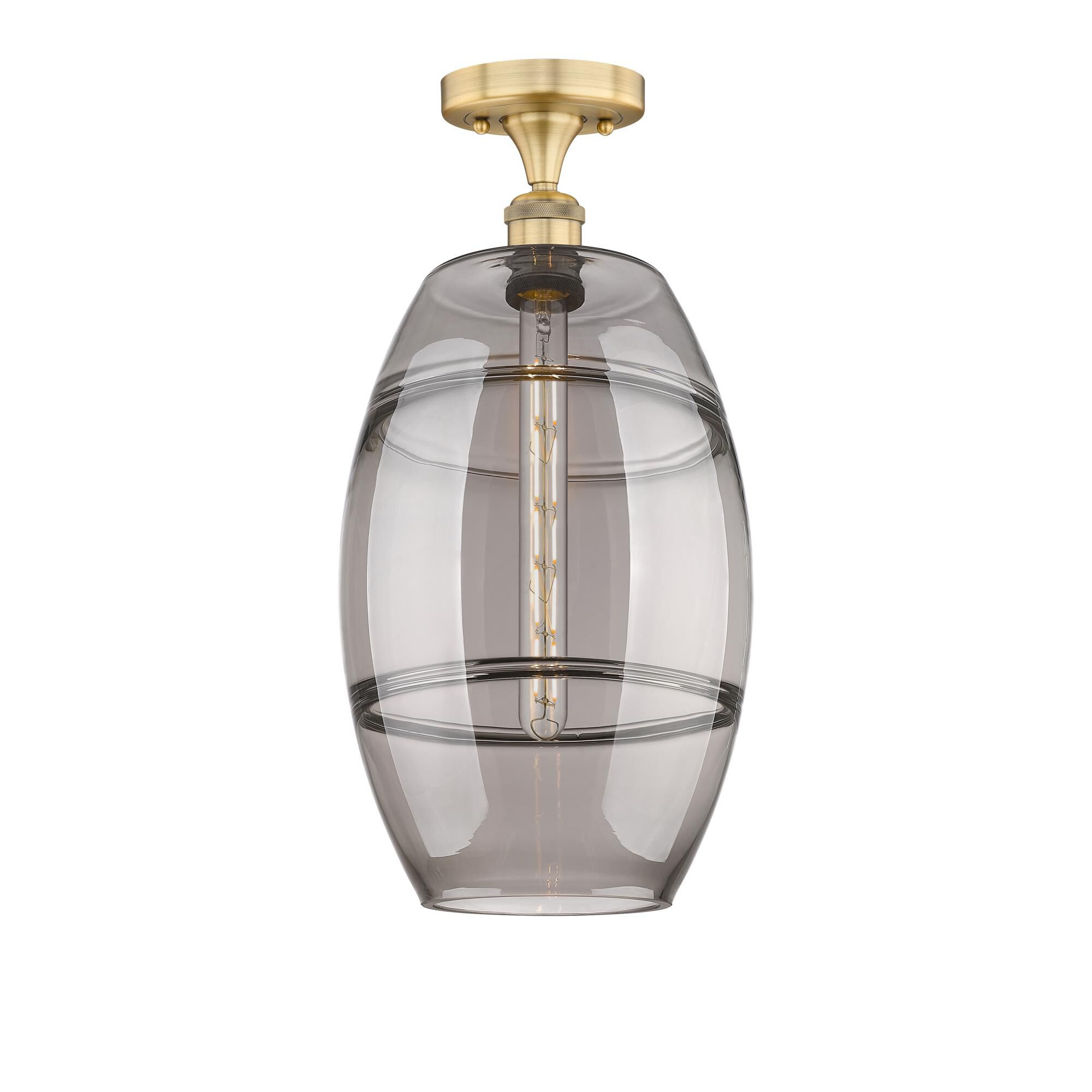 Shown in Brushed Brass finish and Light Smoke glass