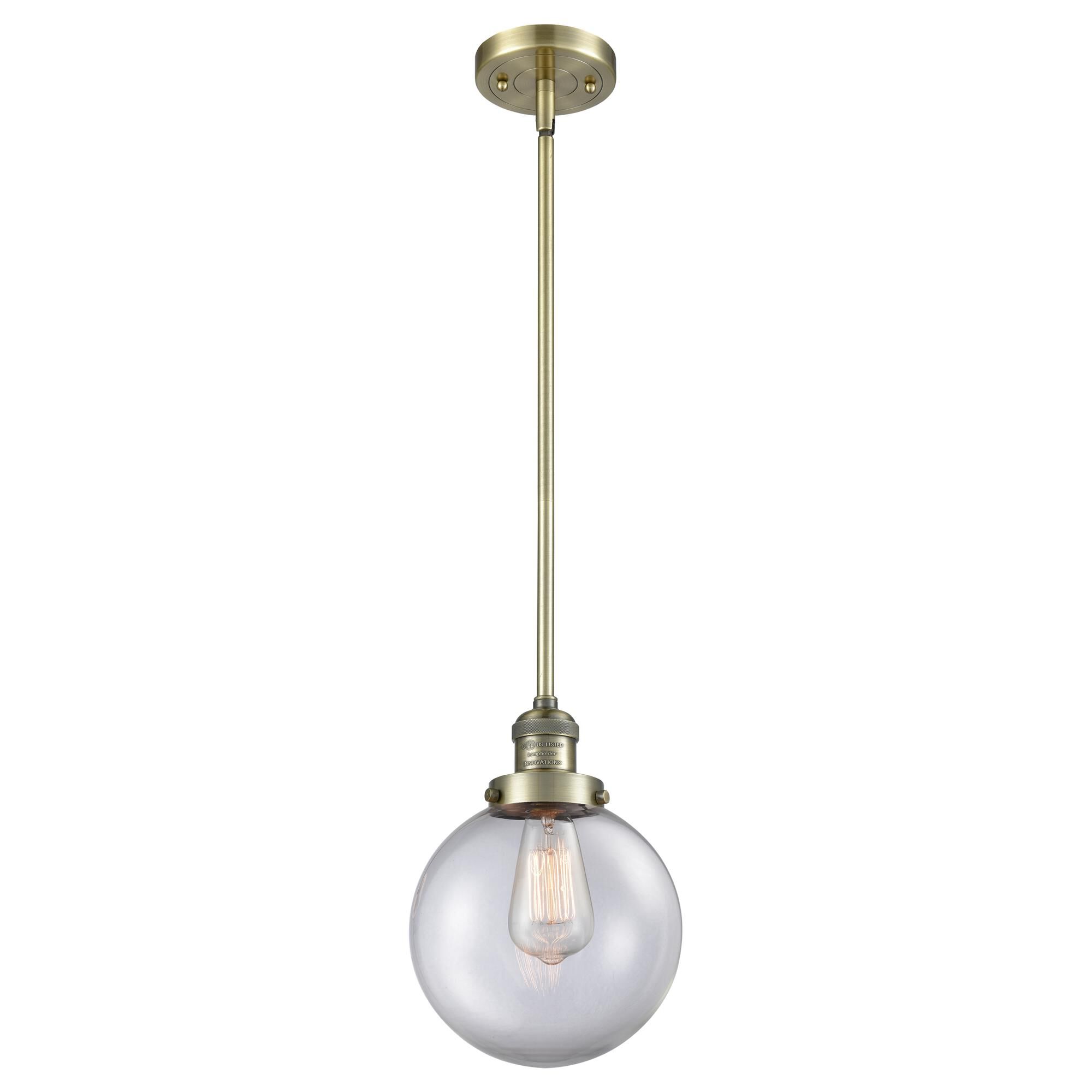 Shown in Antique Brass finish and Clear glass