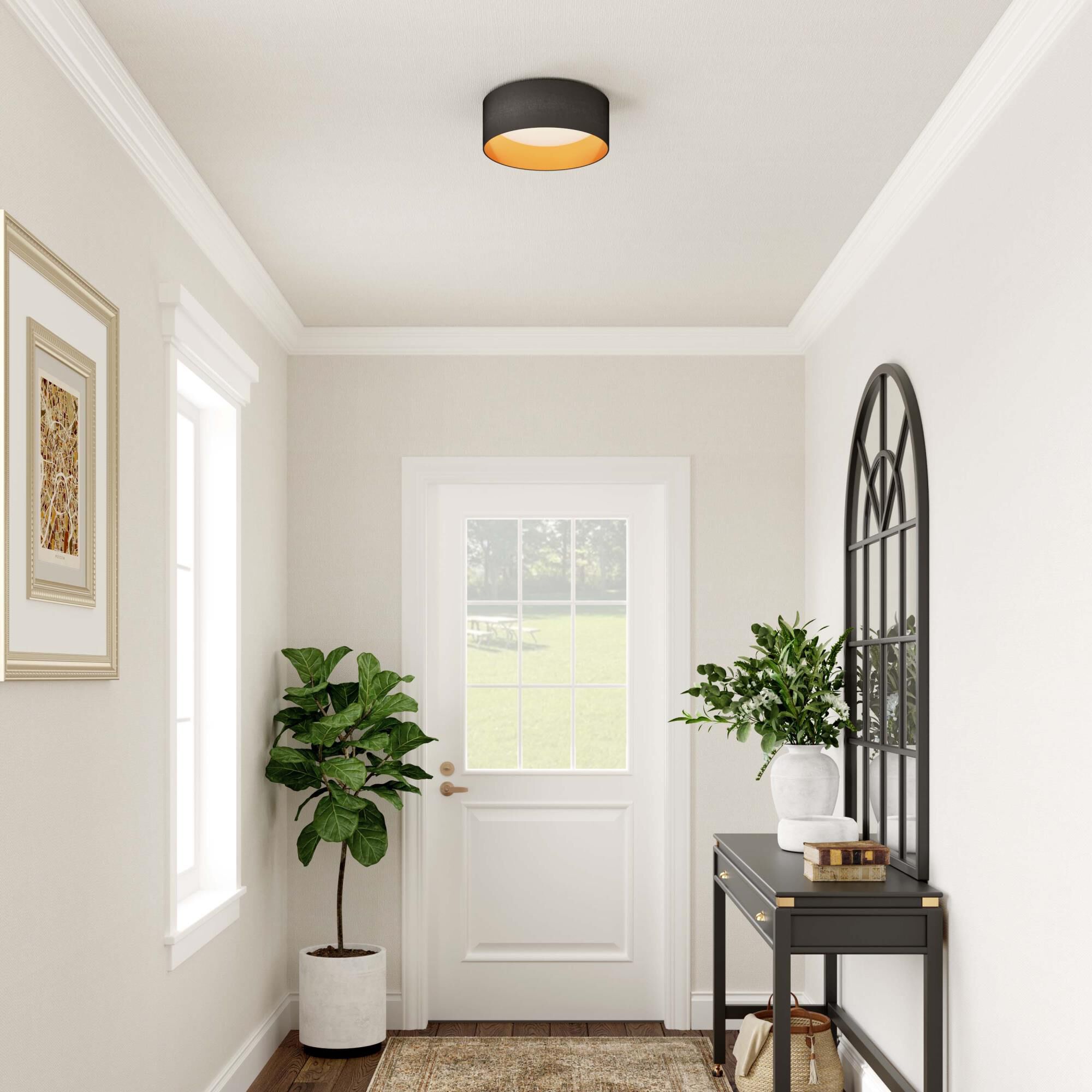 Shown in Burnished Gold finish and Black Fabric shade