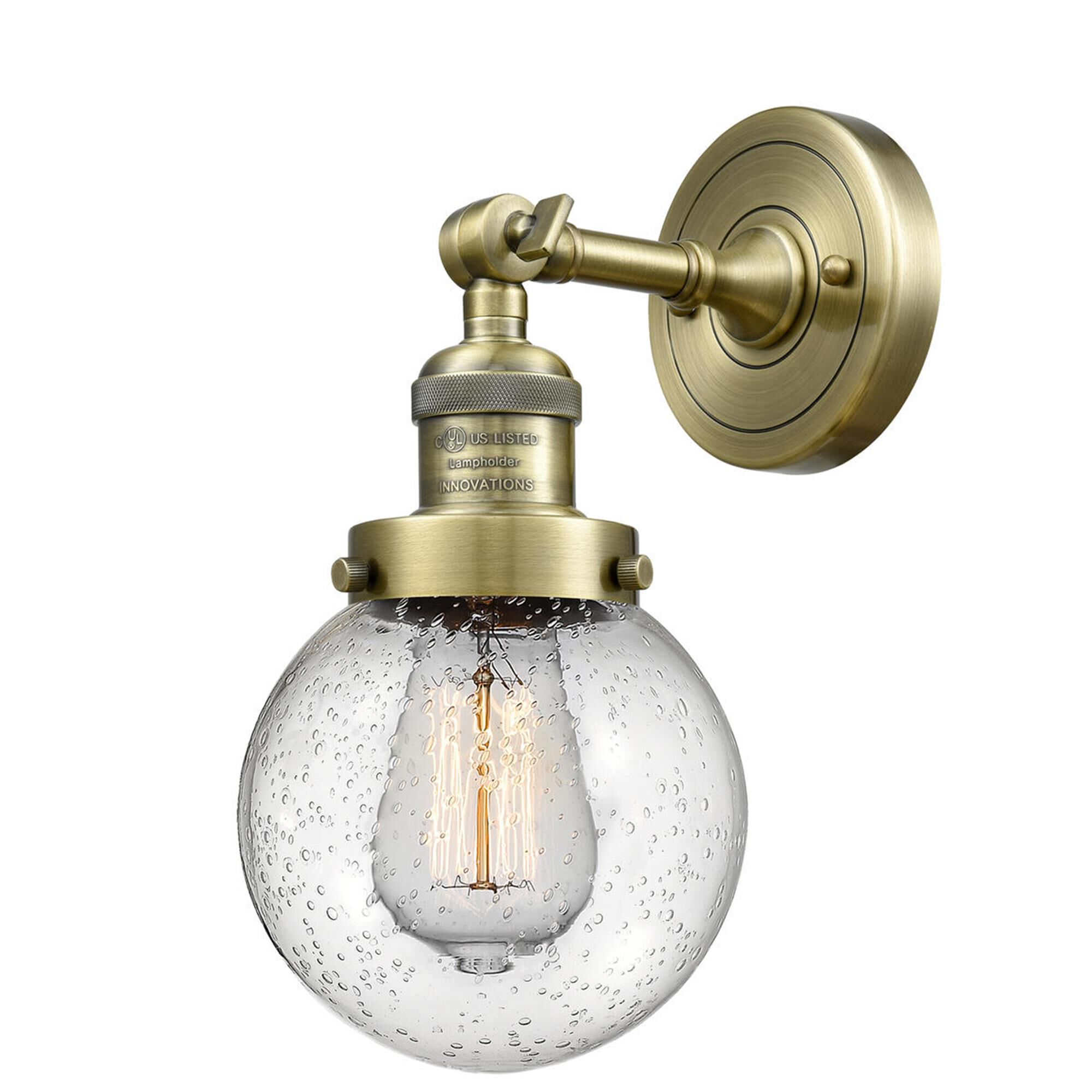 Shown in Antique Brass finish and Seedy glass and No Accent accent