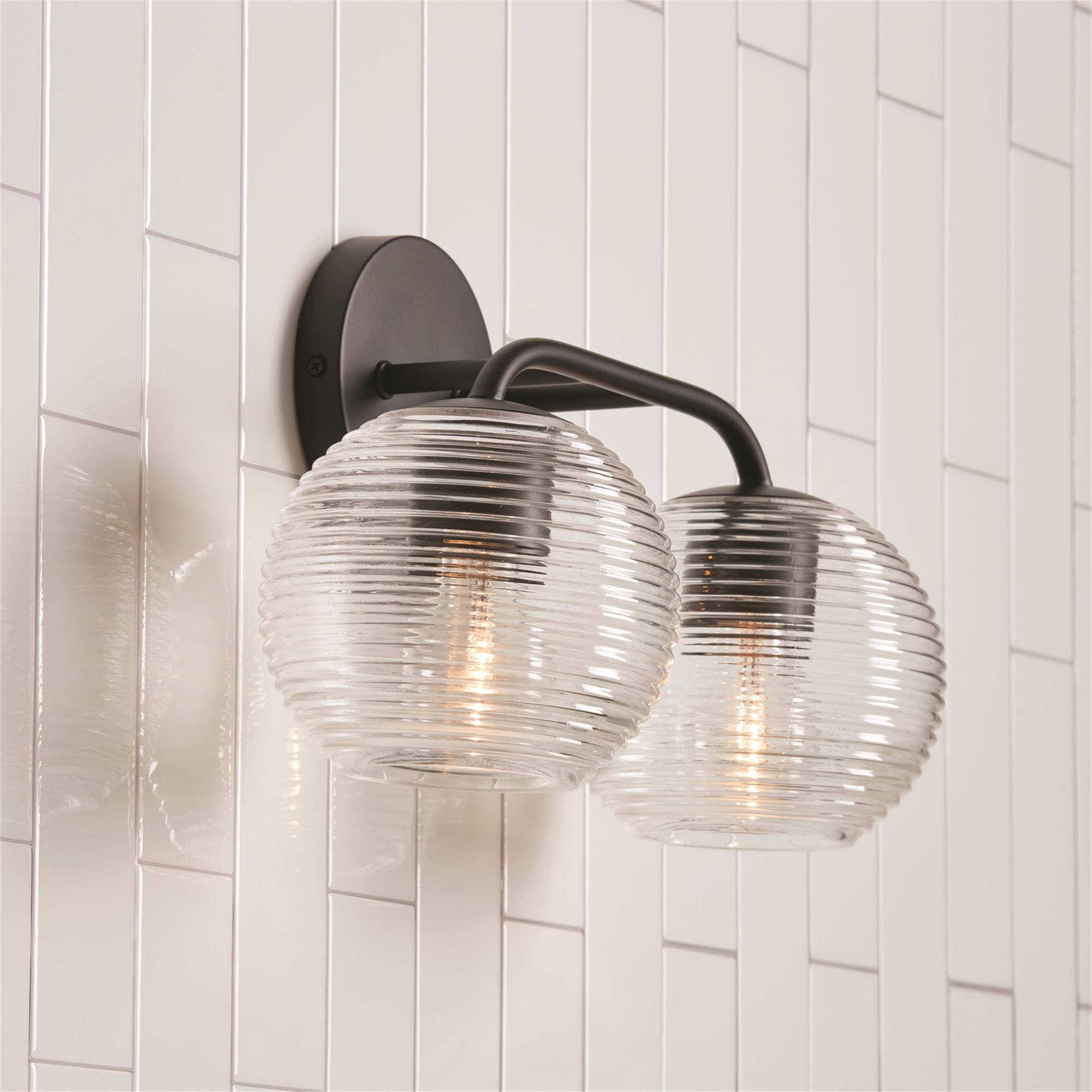 Shown in Matte Black finish and Clear Ribbed glass