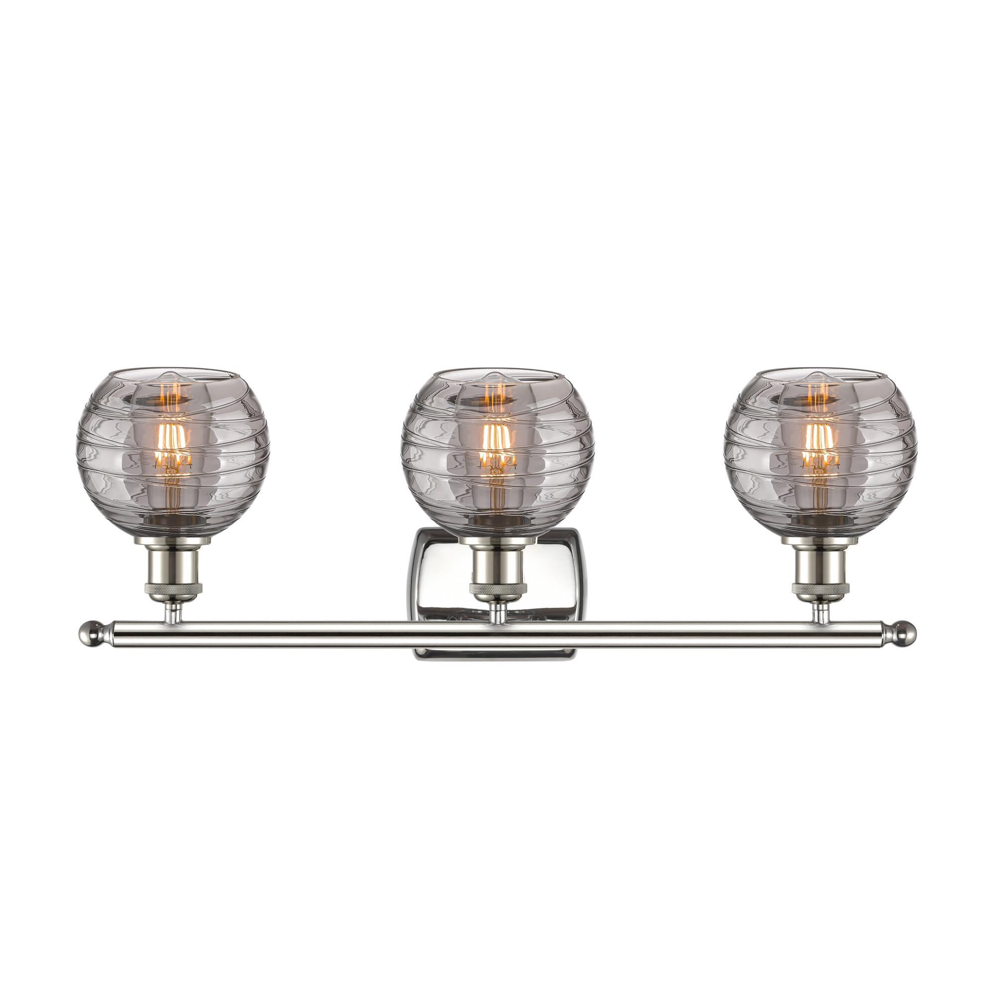 Shown in Polished Nickel finish and Light Smoke Deco Swirl glass