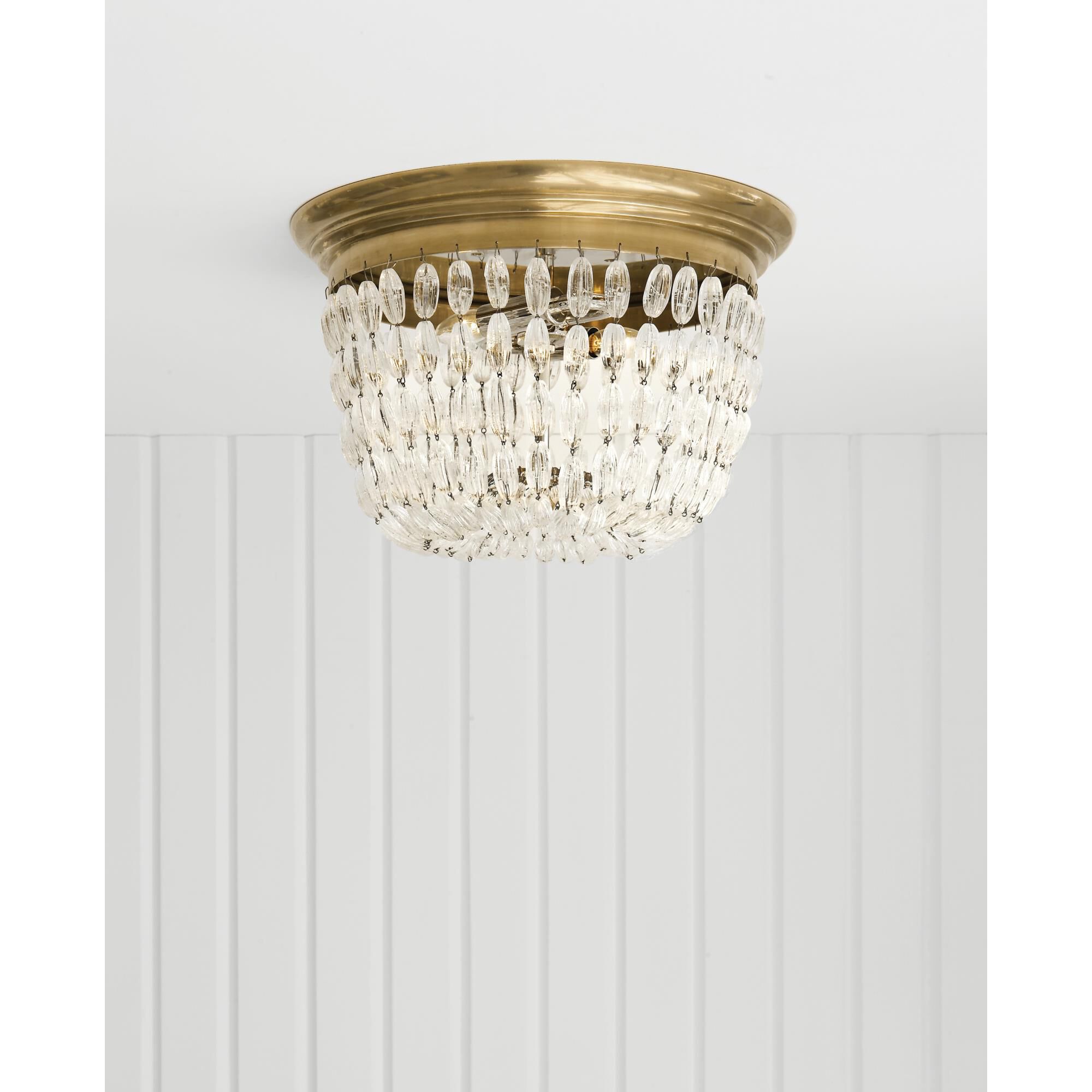 Shown in Antique-Burnished Brass finish and Seeded glass