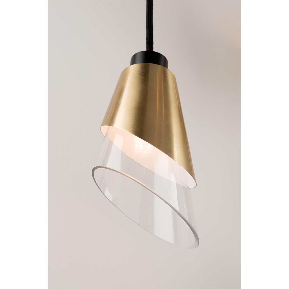 Shown in Aged Brass finish and Opal Etched glass and Black accent