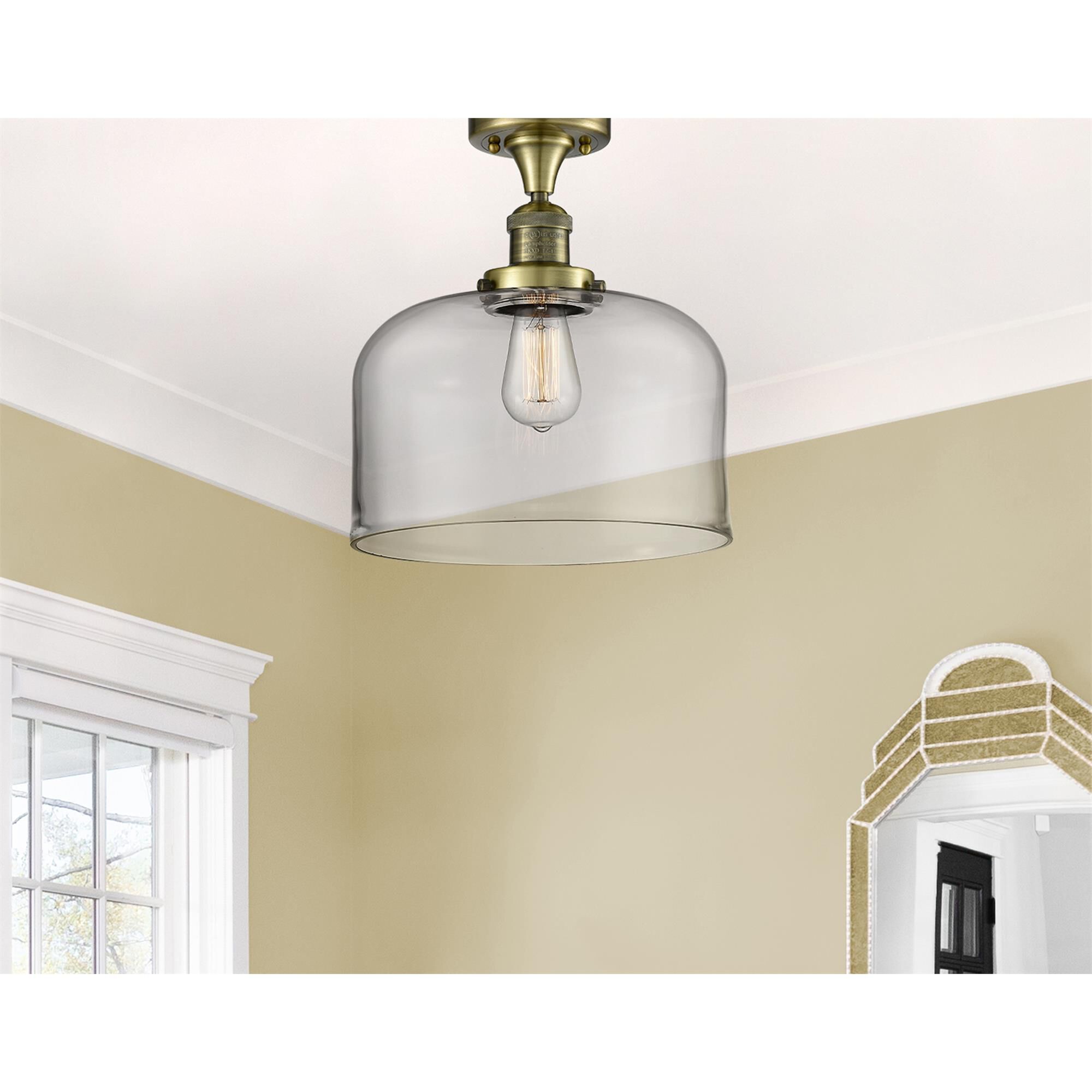 Shown in Antique Brass finish and Clear glass